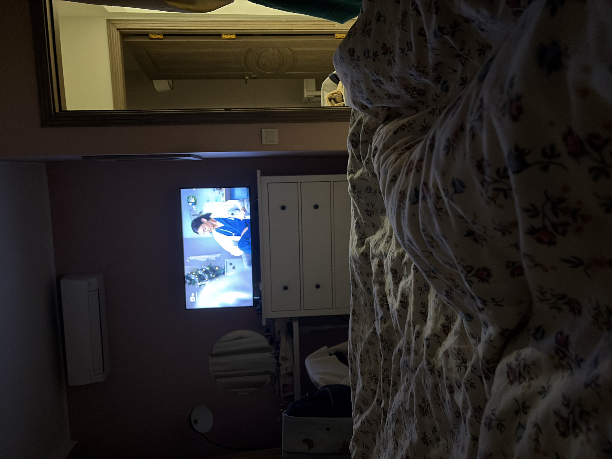 Woman rests with stuffed animal in Burgas bedroom