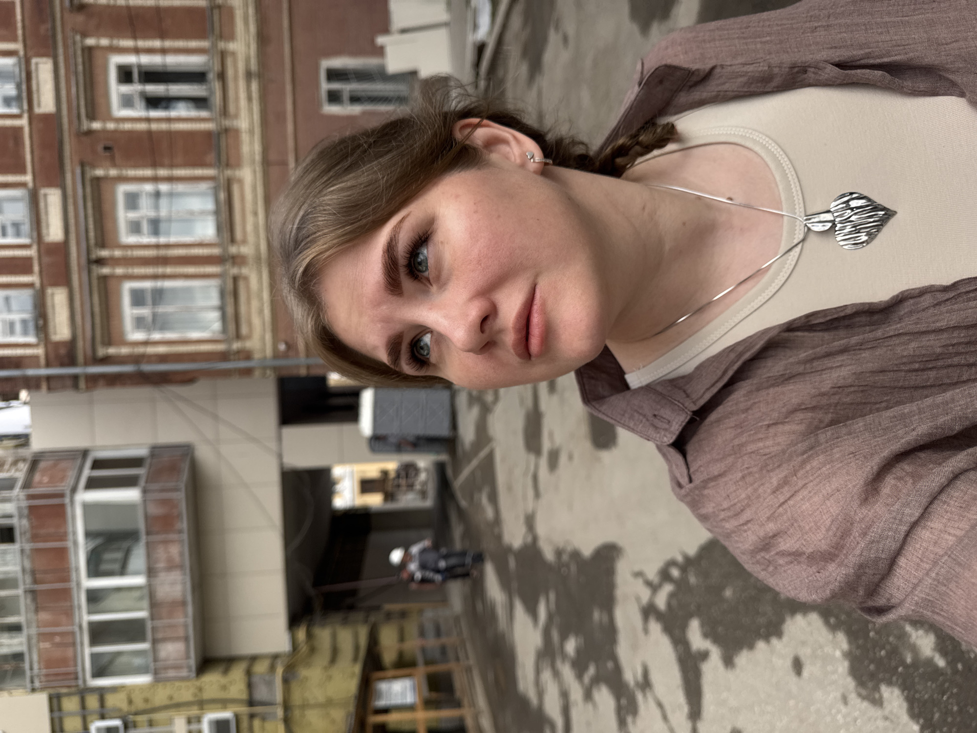 Young woman photographed on Perm street in early morning