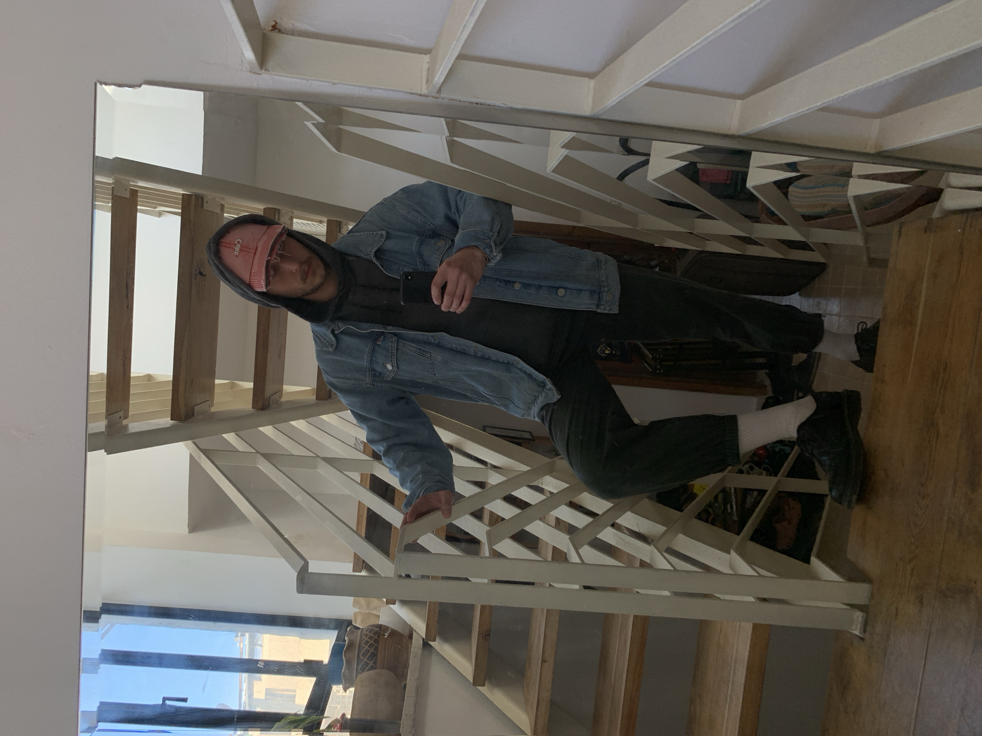 Man takes mirror selfies on staircase in Tel-Aviv residence