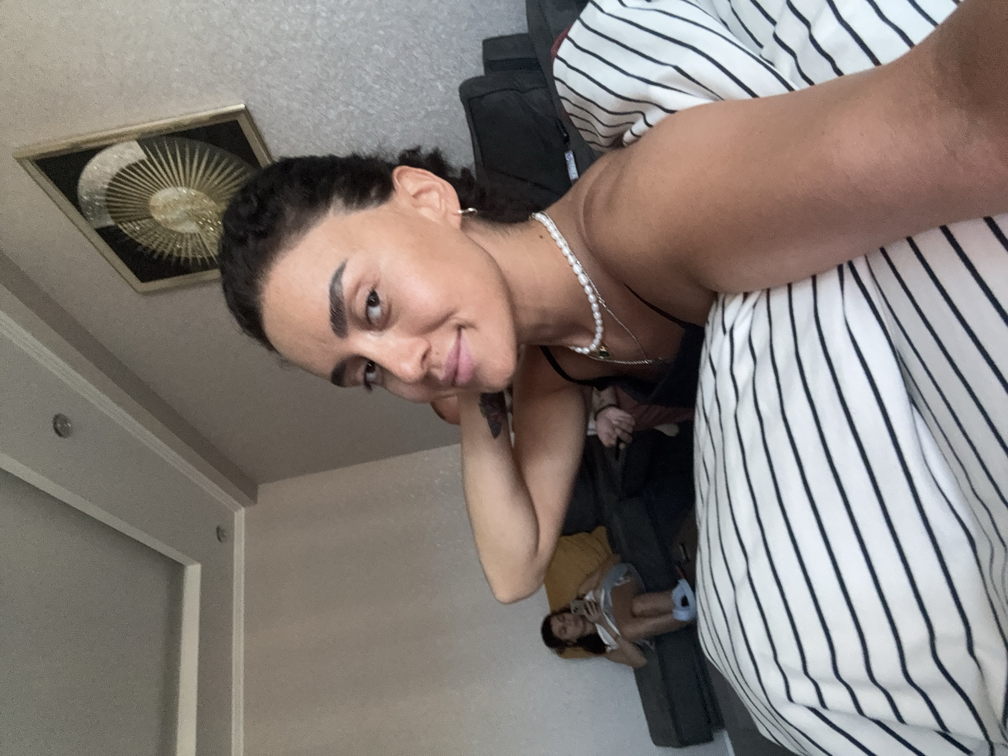 Casual selfies at a Tbilisi apartment, July 2026