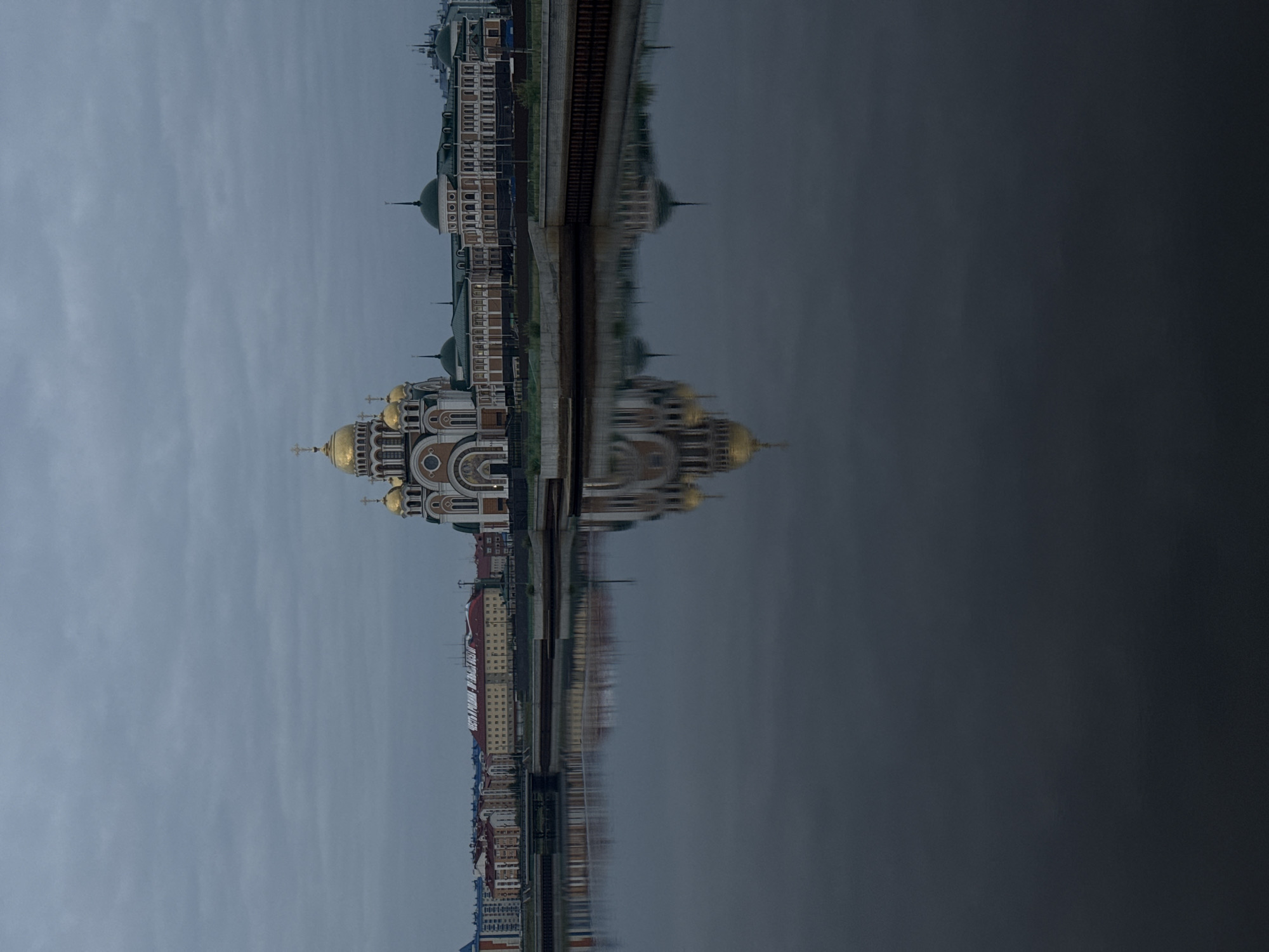 Salekhard's riverfront: golden domes and the Chum Bridge