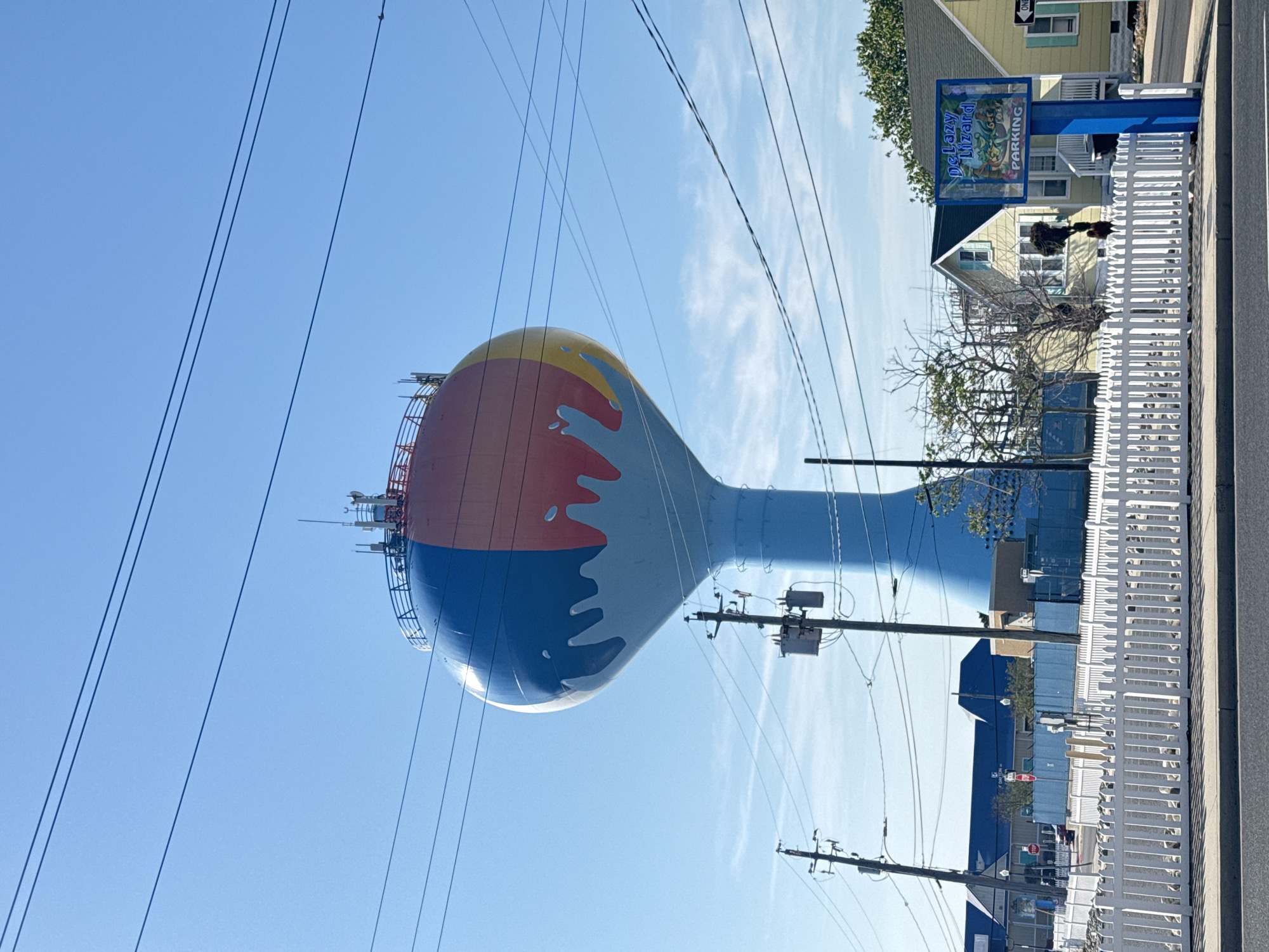 Tourist documents Ocean City landmarks during evening walkabout