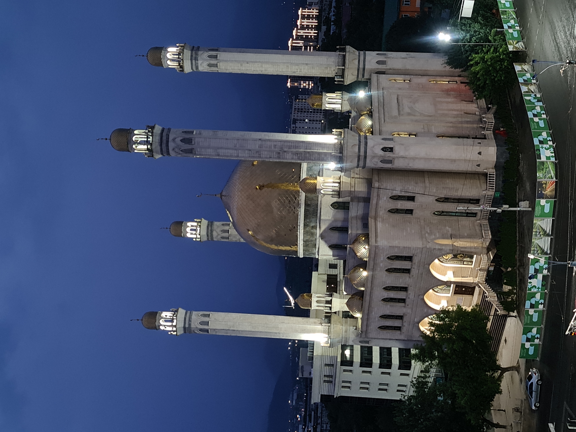 Almaty's Central Mosque glows at dusk from multiple angles
