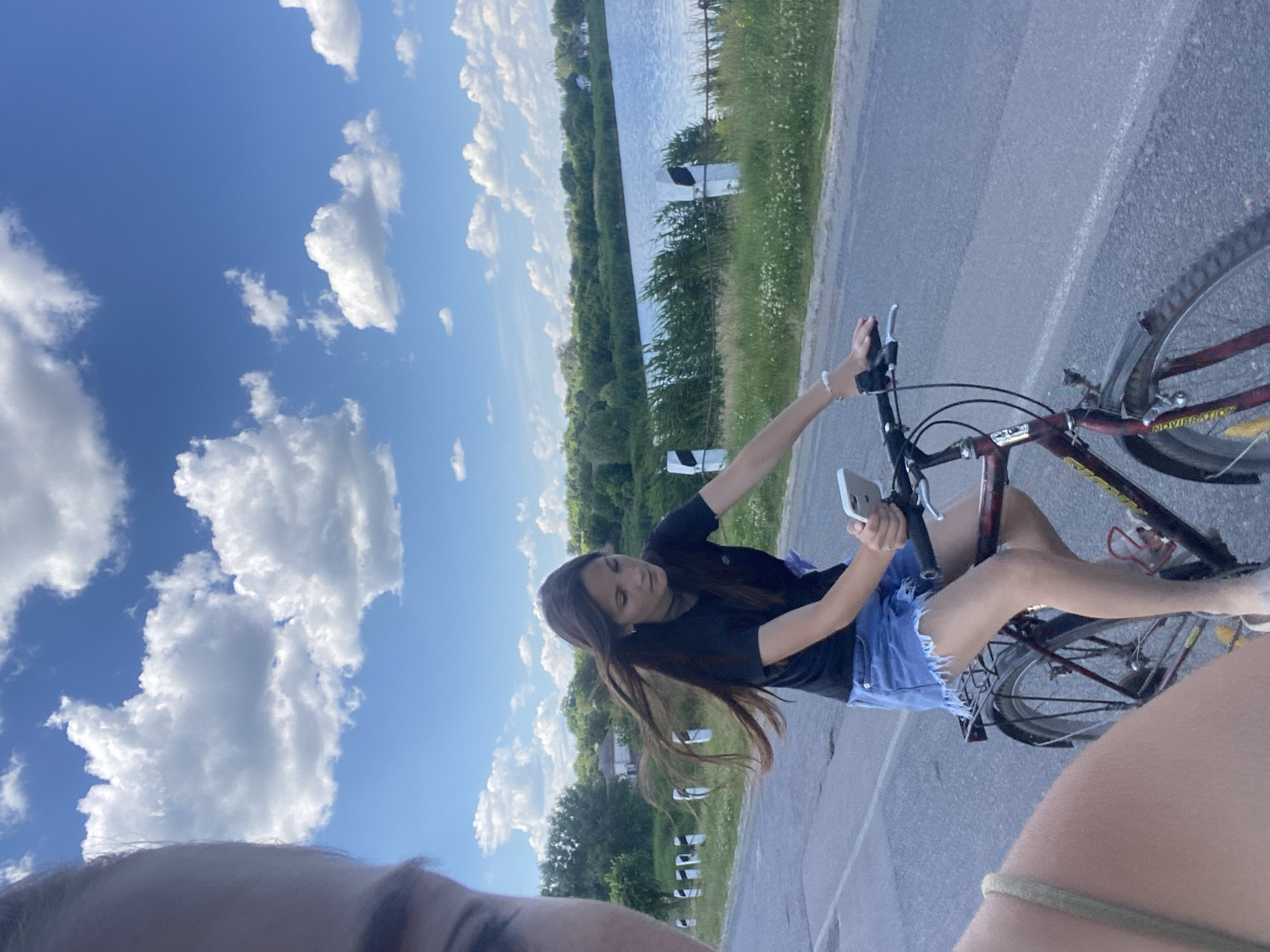 Cycling past an abandoned building on a quiet rural road