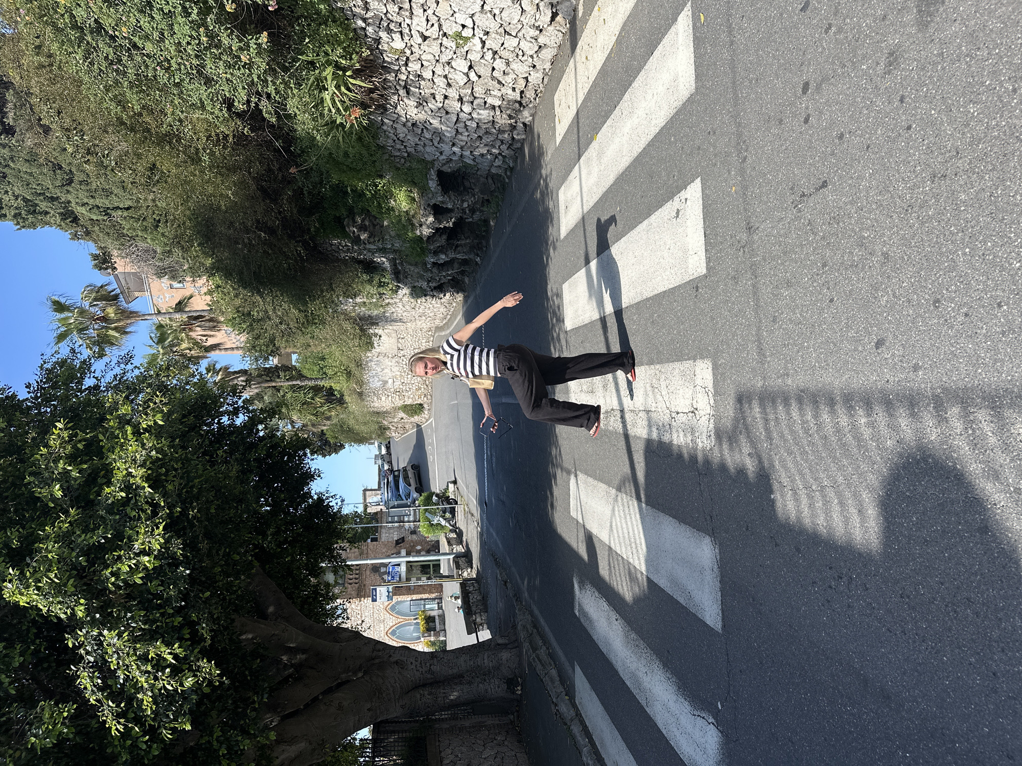 Woman poses for social media challenge in Taormina, Italy