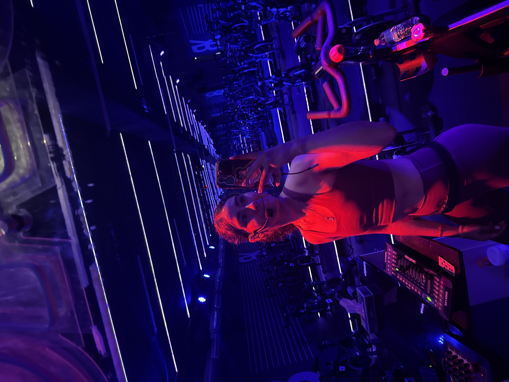 Woman documents spin class workout in Puebla fitness studio