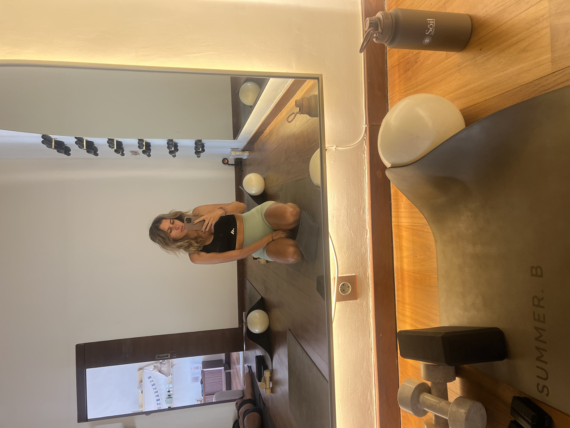 Inside a Mengwi yoga studio, floor selfies and retail display