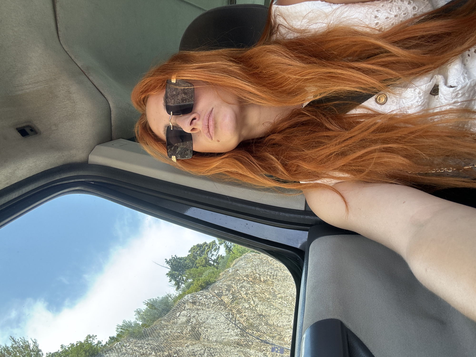 Inside a car on a sunny Budva street, June 2026