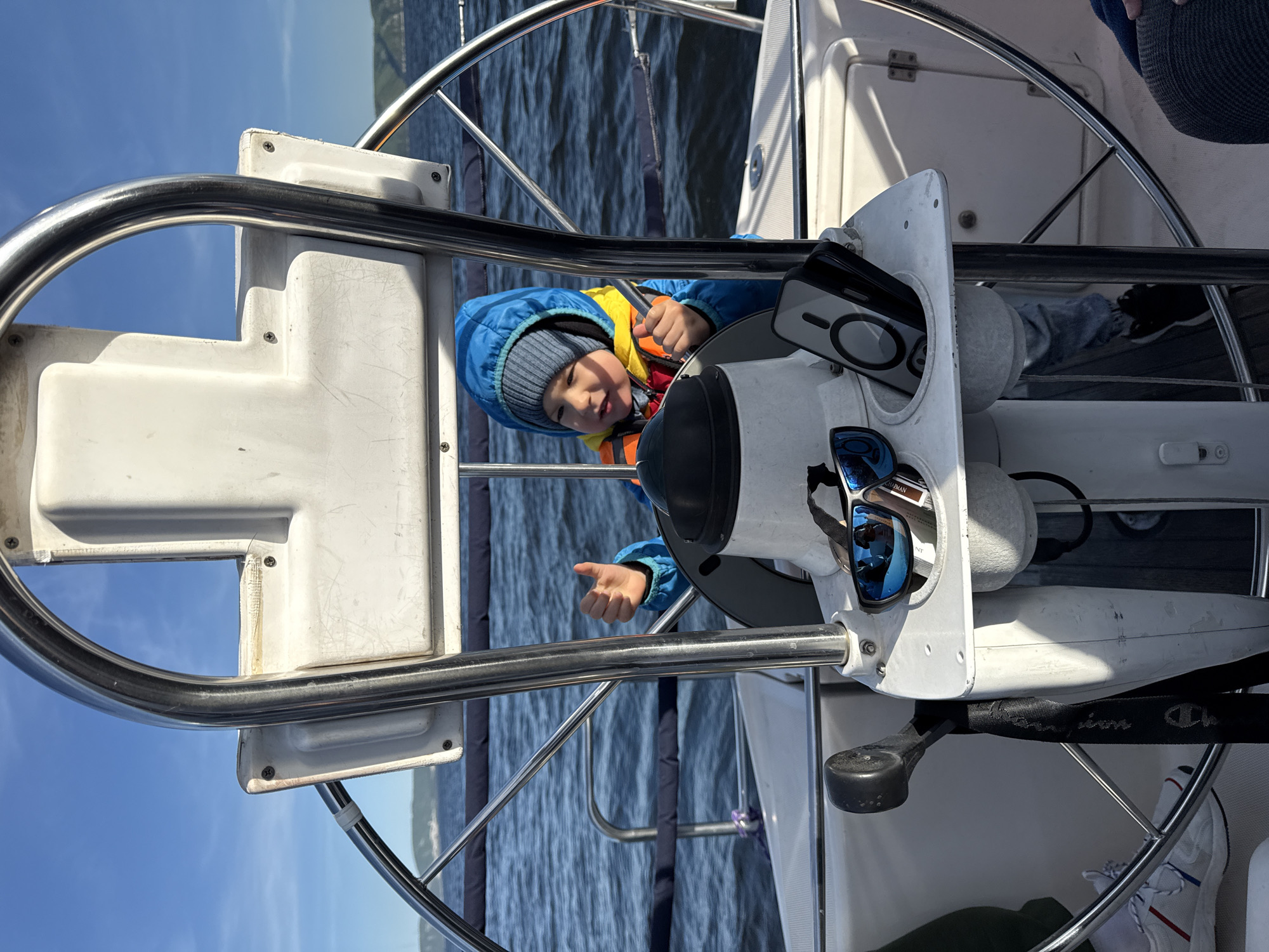 Child takes helm during boat trip near Tolyatti cliffs