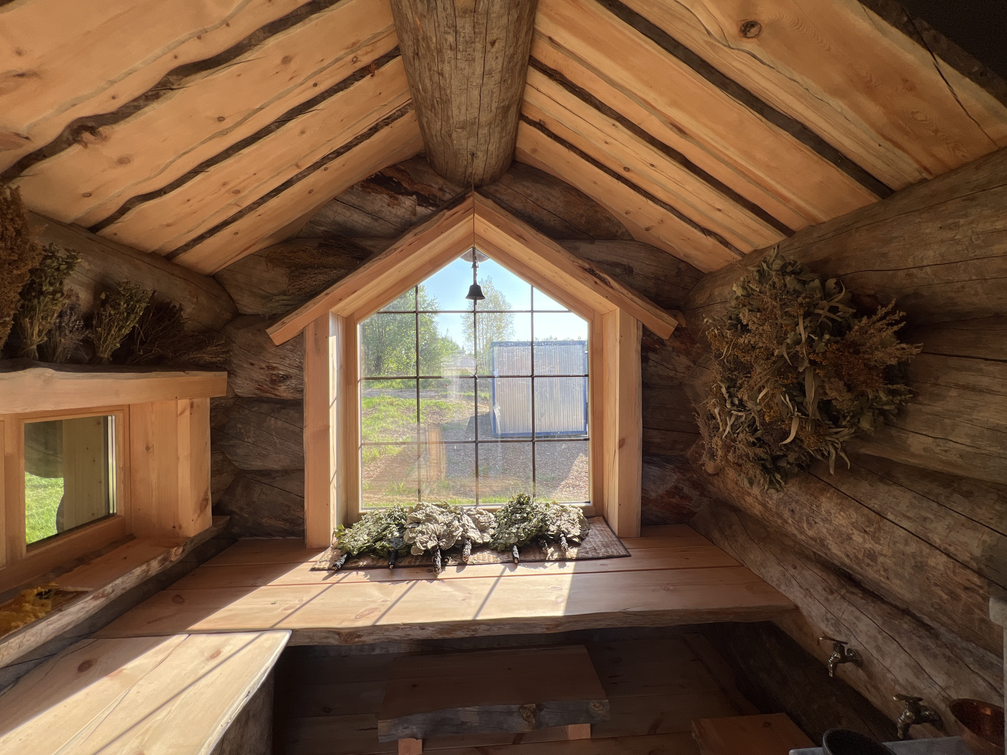 Rustic sauna and orange-filled bathtub at a Yakunino property