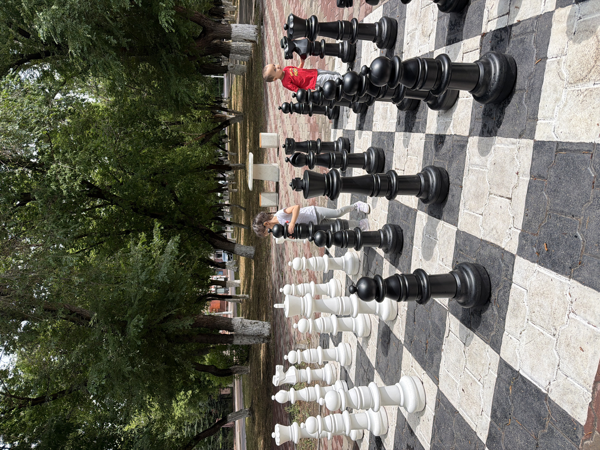 Giant outdoor chess set in a Karaganda park, July morning