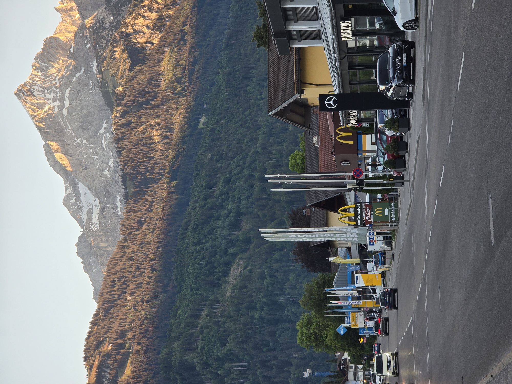 Evening street life documented across Garmisch-Partenkirchen's Alpine backdrop