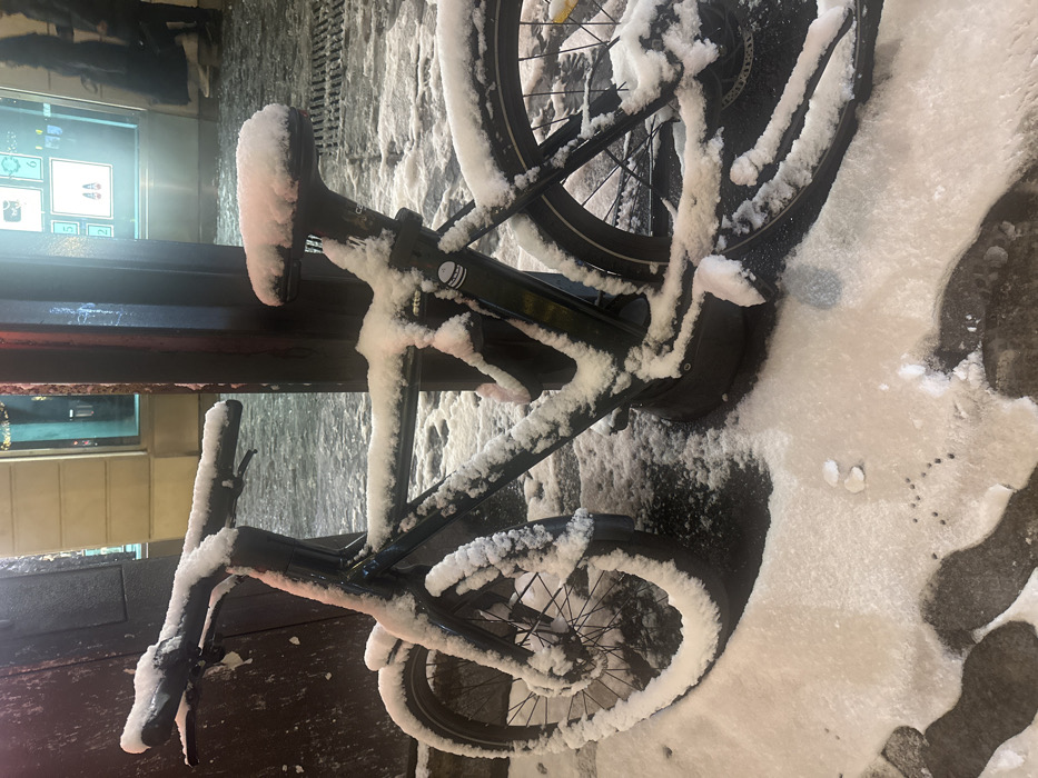 Snow-covered electric bike spotted in snowy Paris street