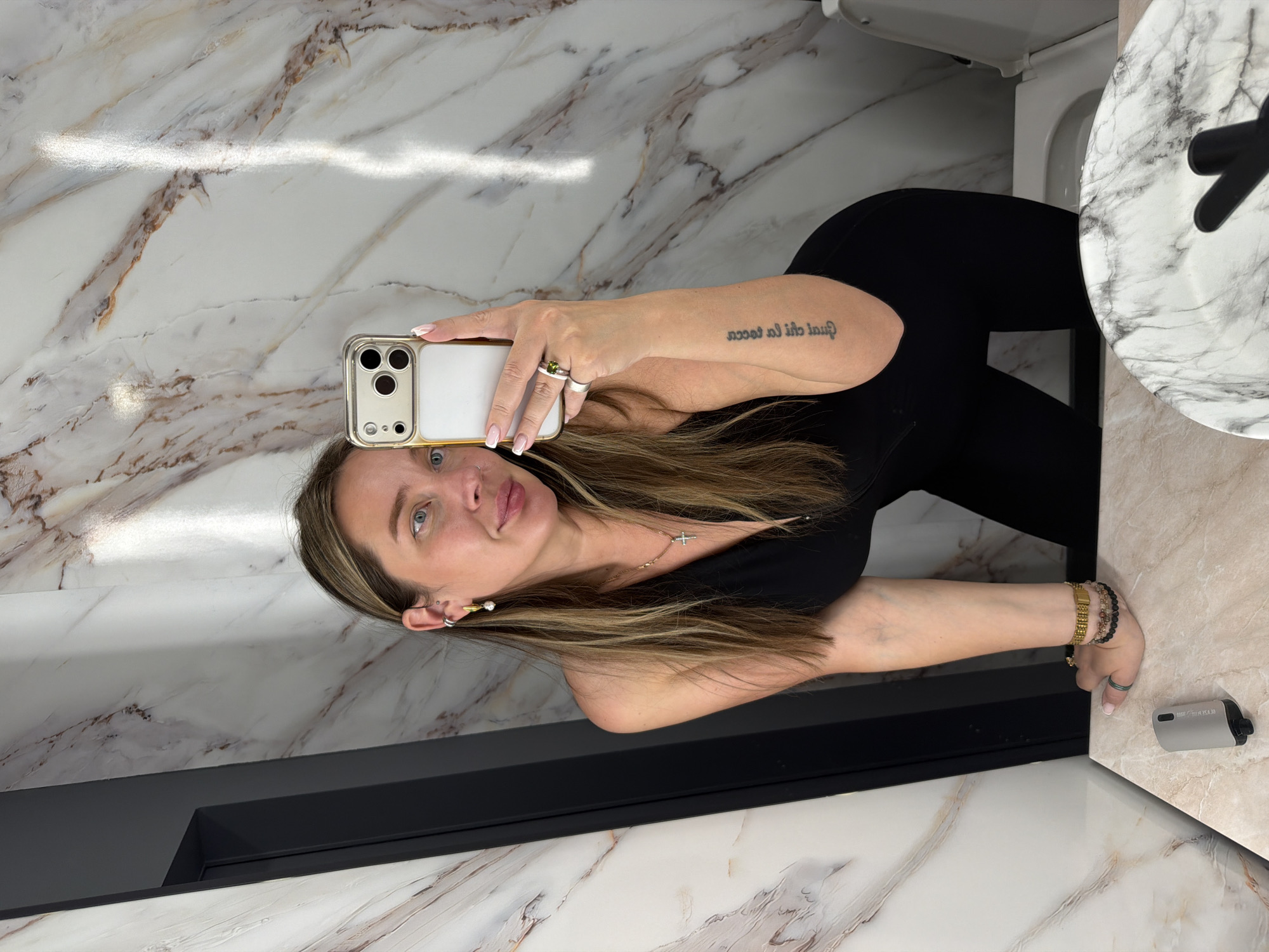 Woman takes bathroom selfie in marble-walled Moscow restroom