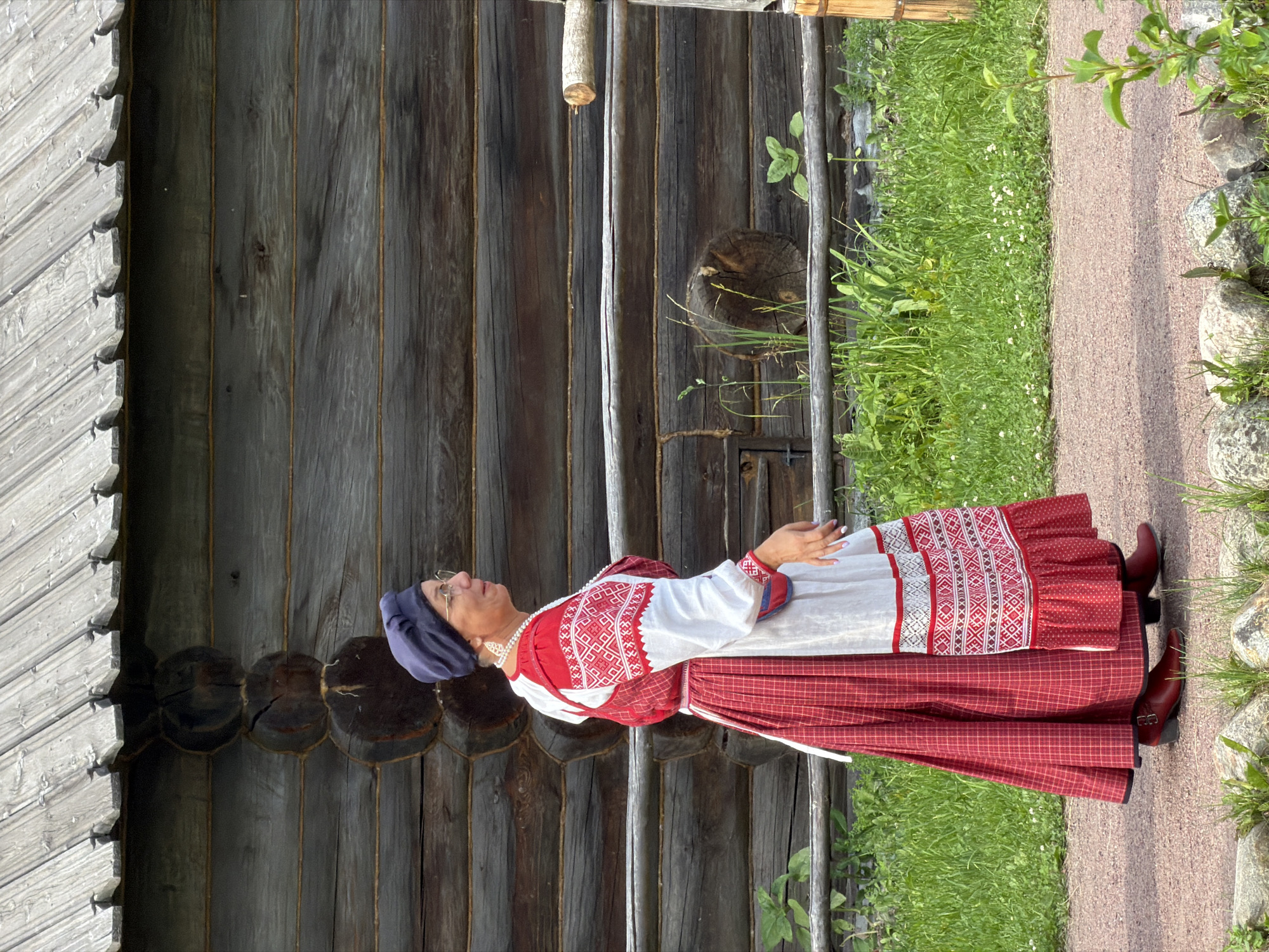 Traditional wooden architecture and folk dress at Dnp Ryzhiki