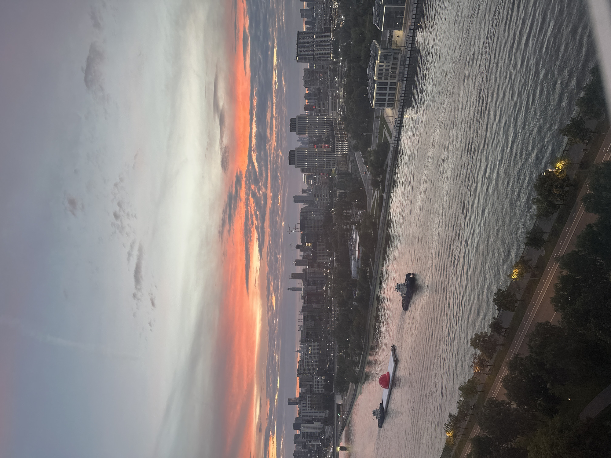 Barge moves down the Moskva River at sunset