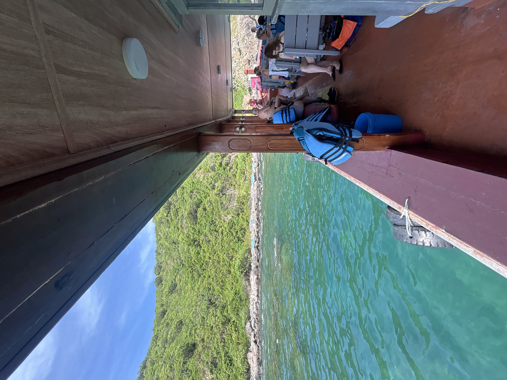 Cruising Nha Trang's rocky turquoise coastline by boat