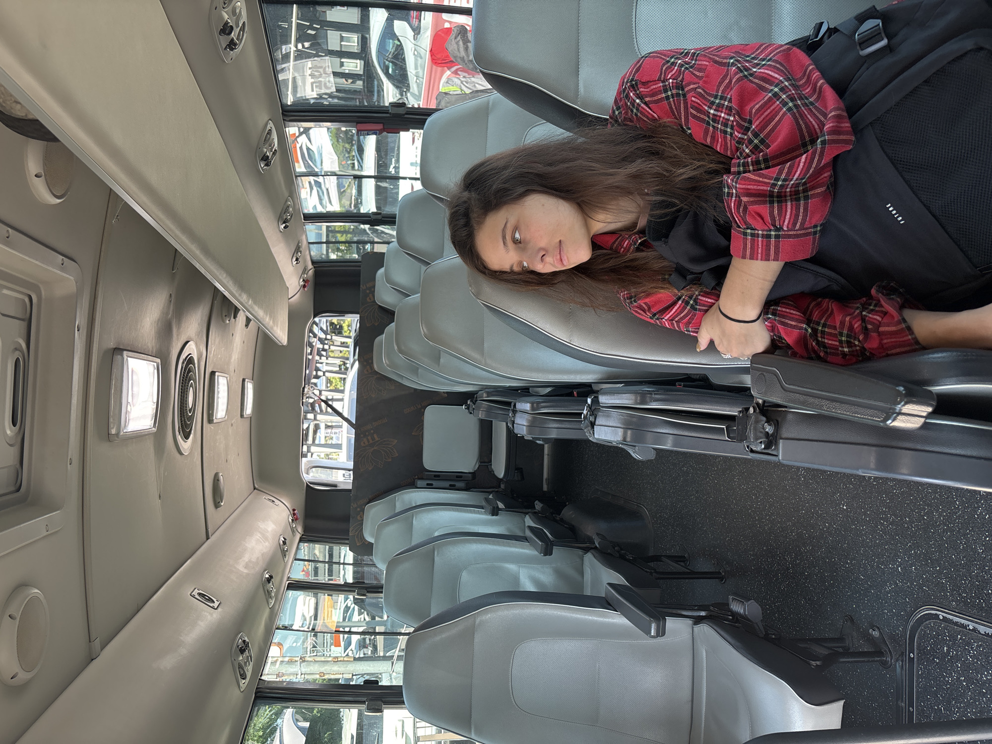 Waiting with luggage at a Jeju transit stop