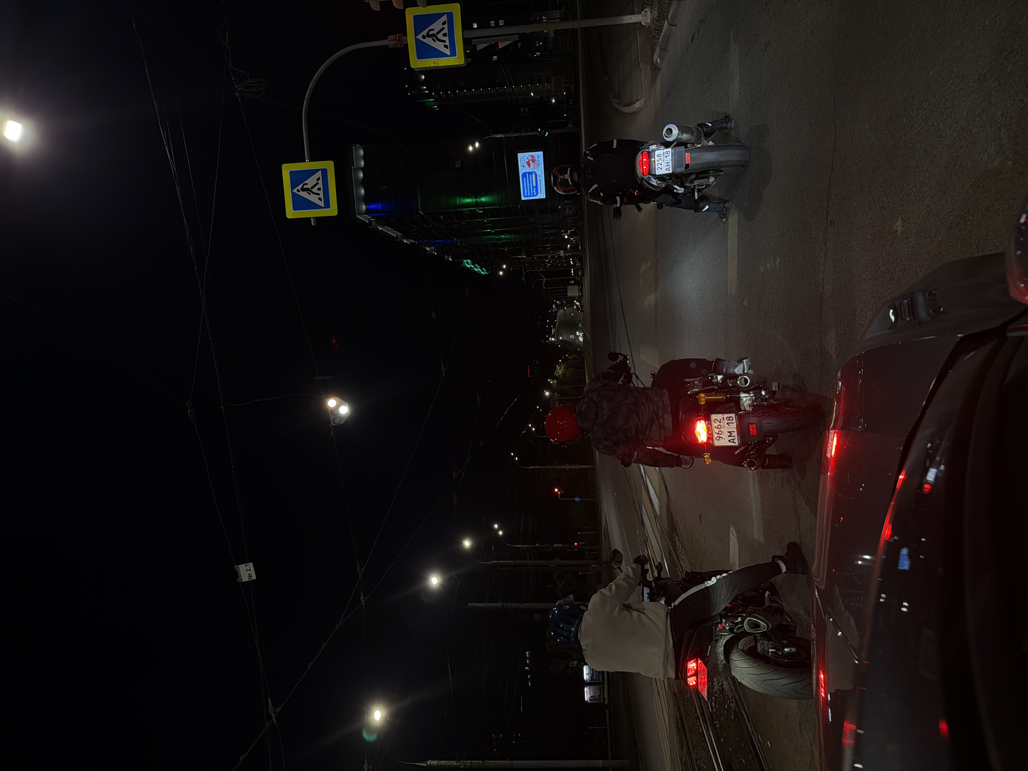 Motorcycles gather at nighttime intersection in Izhevsk, Russia