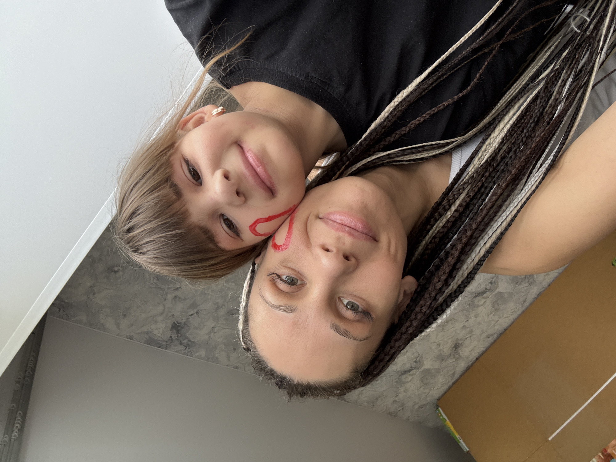 Woman and child share selfie moments in Rusanovo