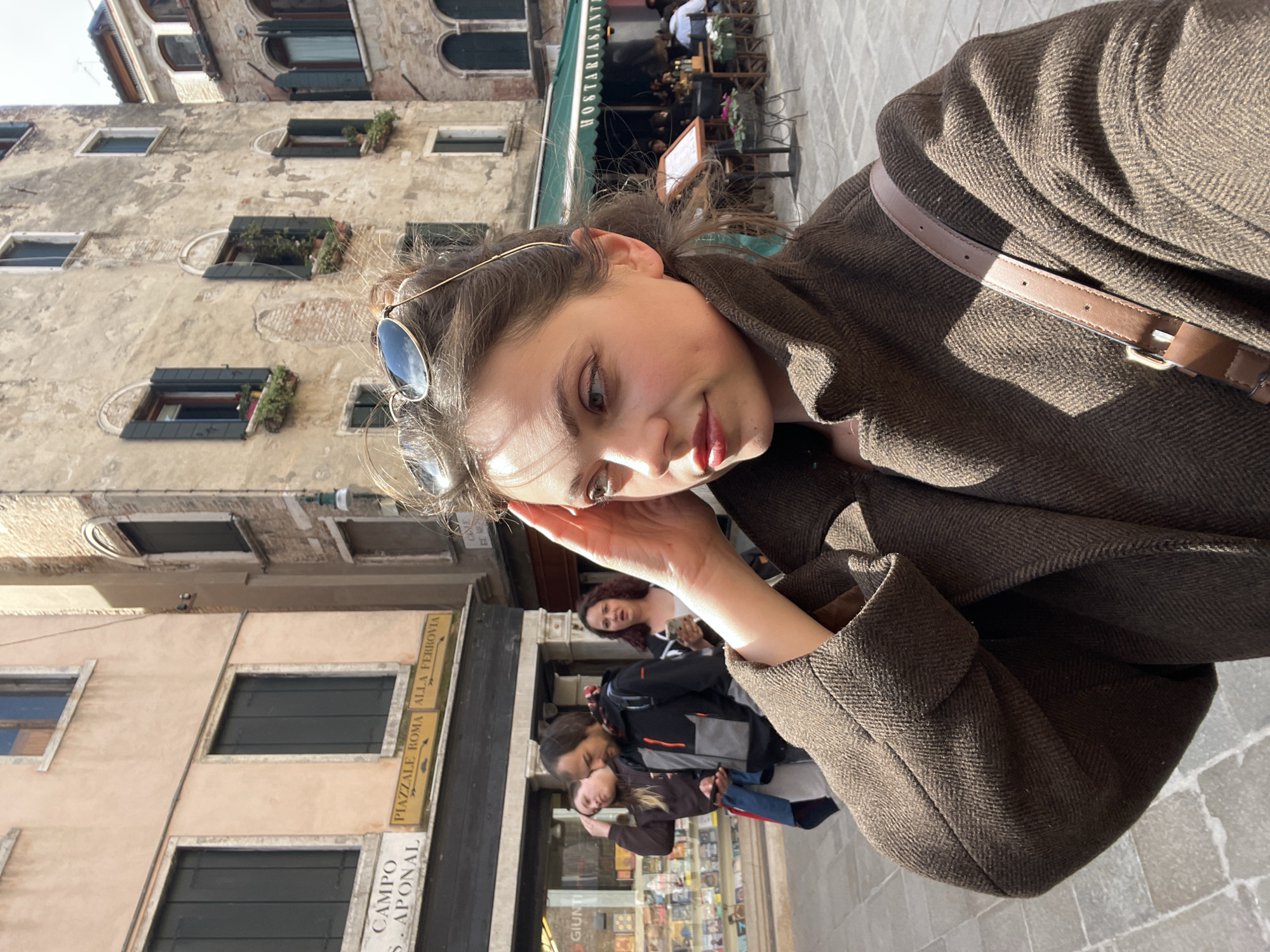 Tourists and architecture documented in Venice midday scenes