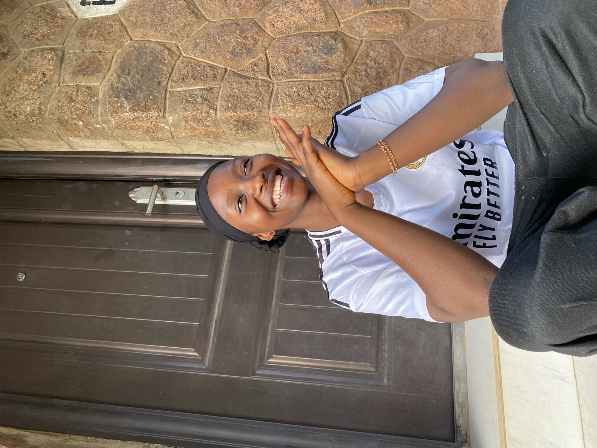 Portrait session captured in Vom, Nigeria brick architecture setting