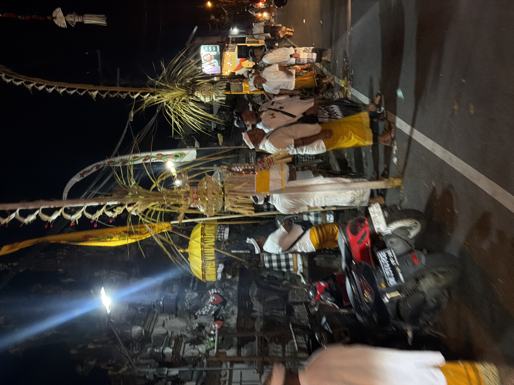 Traditional Balinese gathering on a street in Mengwi at night