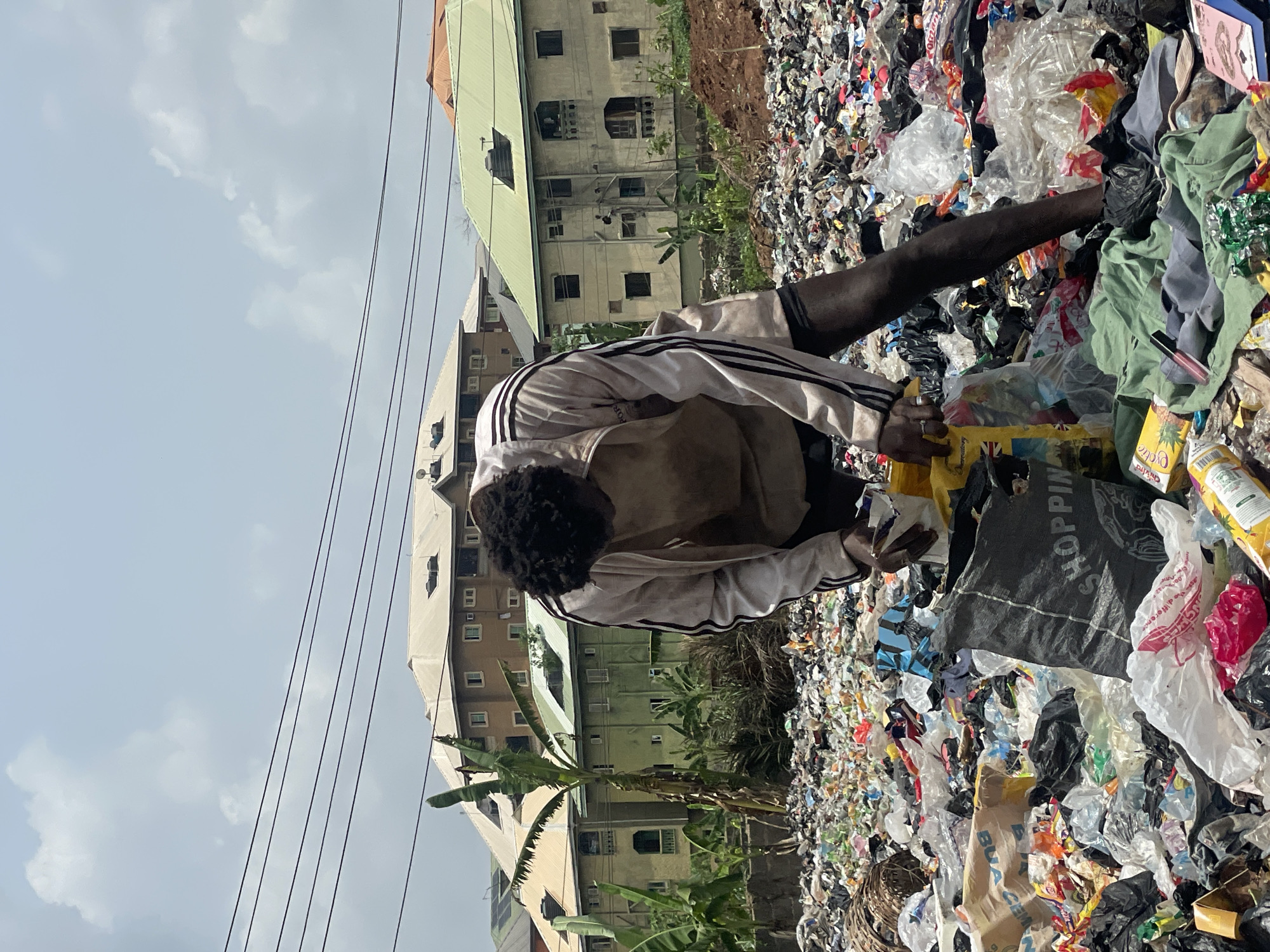 Daily life scenes captured across Onitsha including waste picking