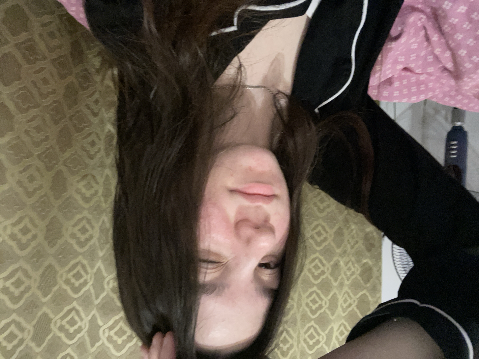 Young woman takes multiple selfies at home in Russia