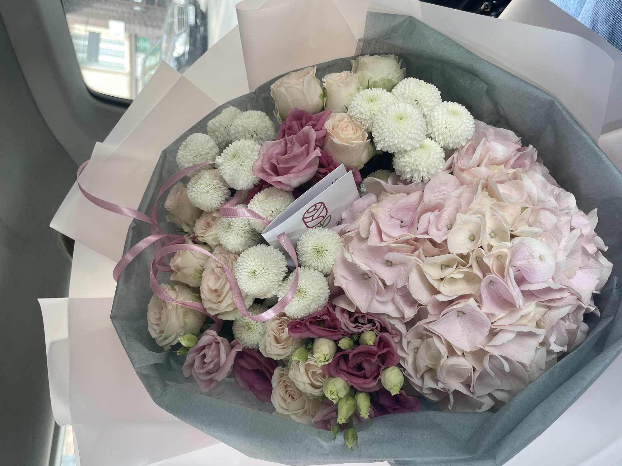 Urban car journey documented with roses, street scenes, construction