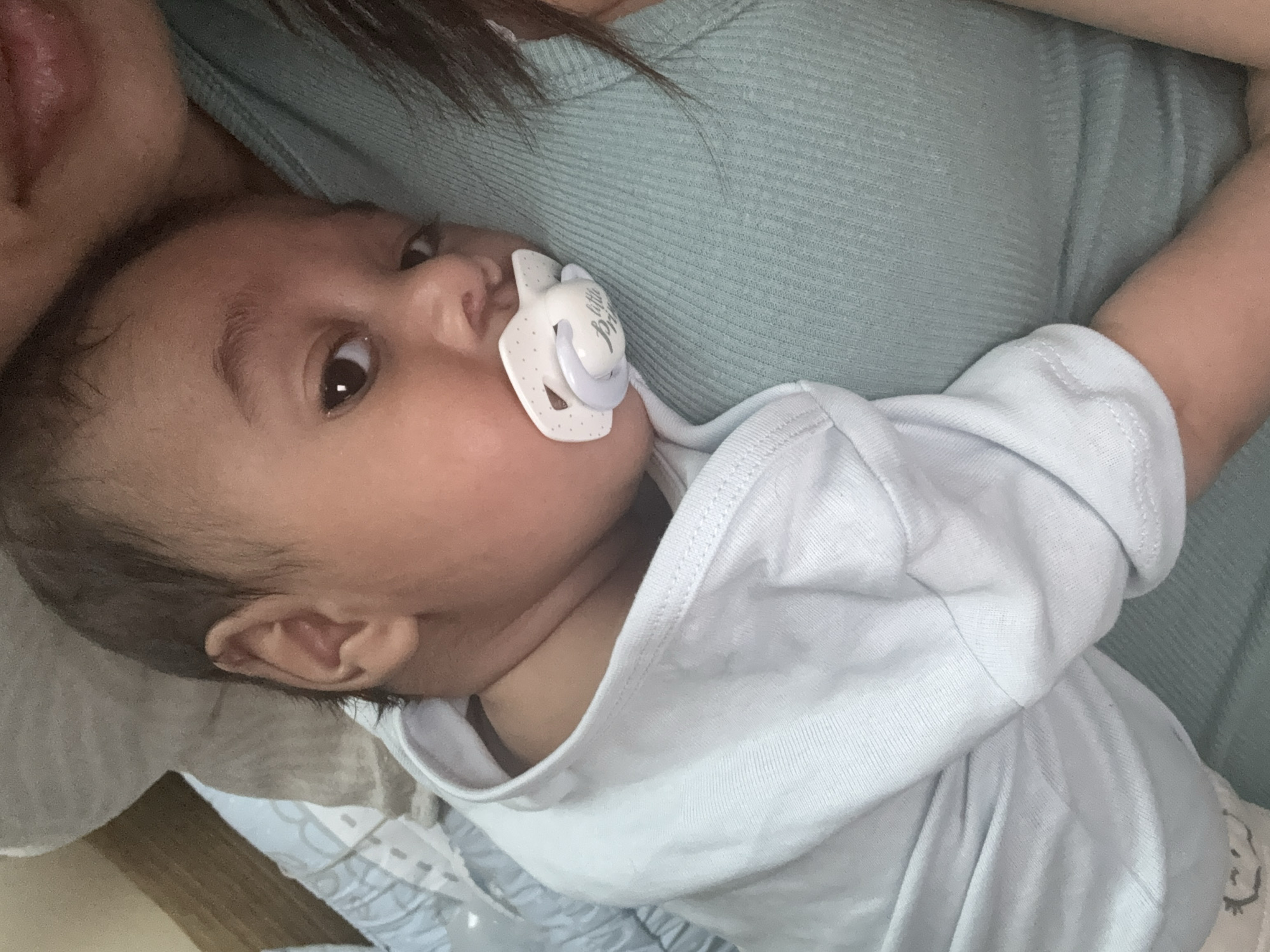 Baby with pacifier photographed in intimate moment, Sofia