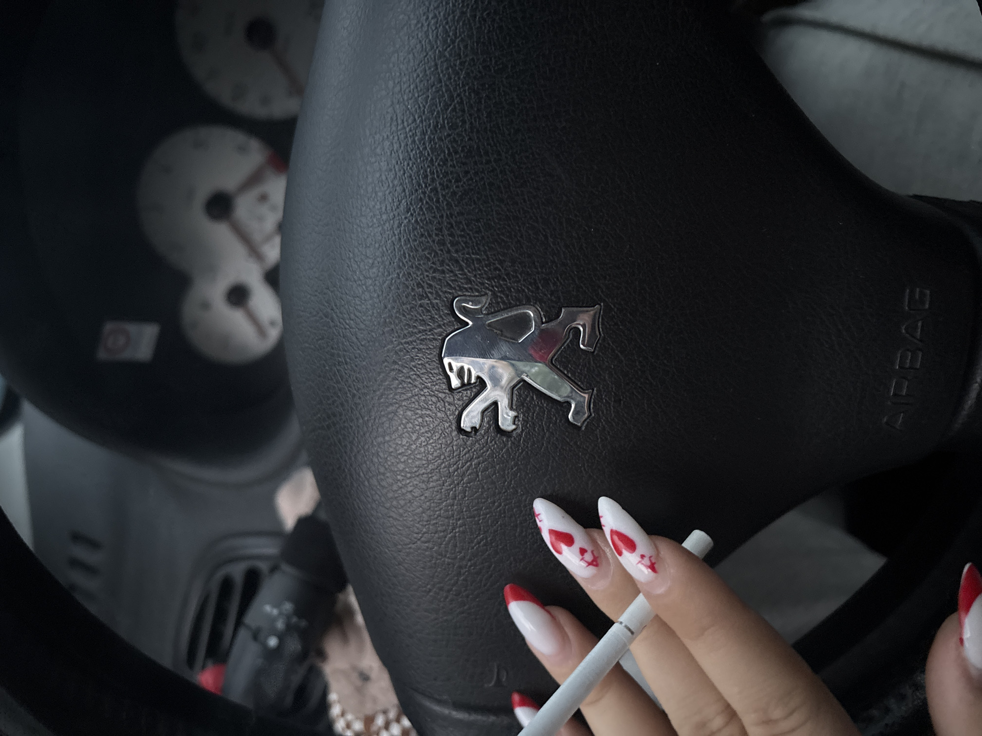 Woman takes smoking break in parked car, Plovdiv