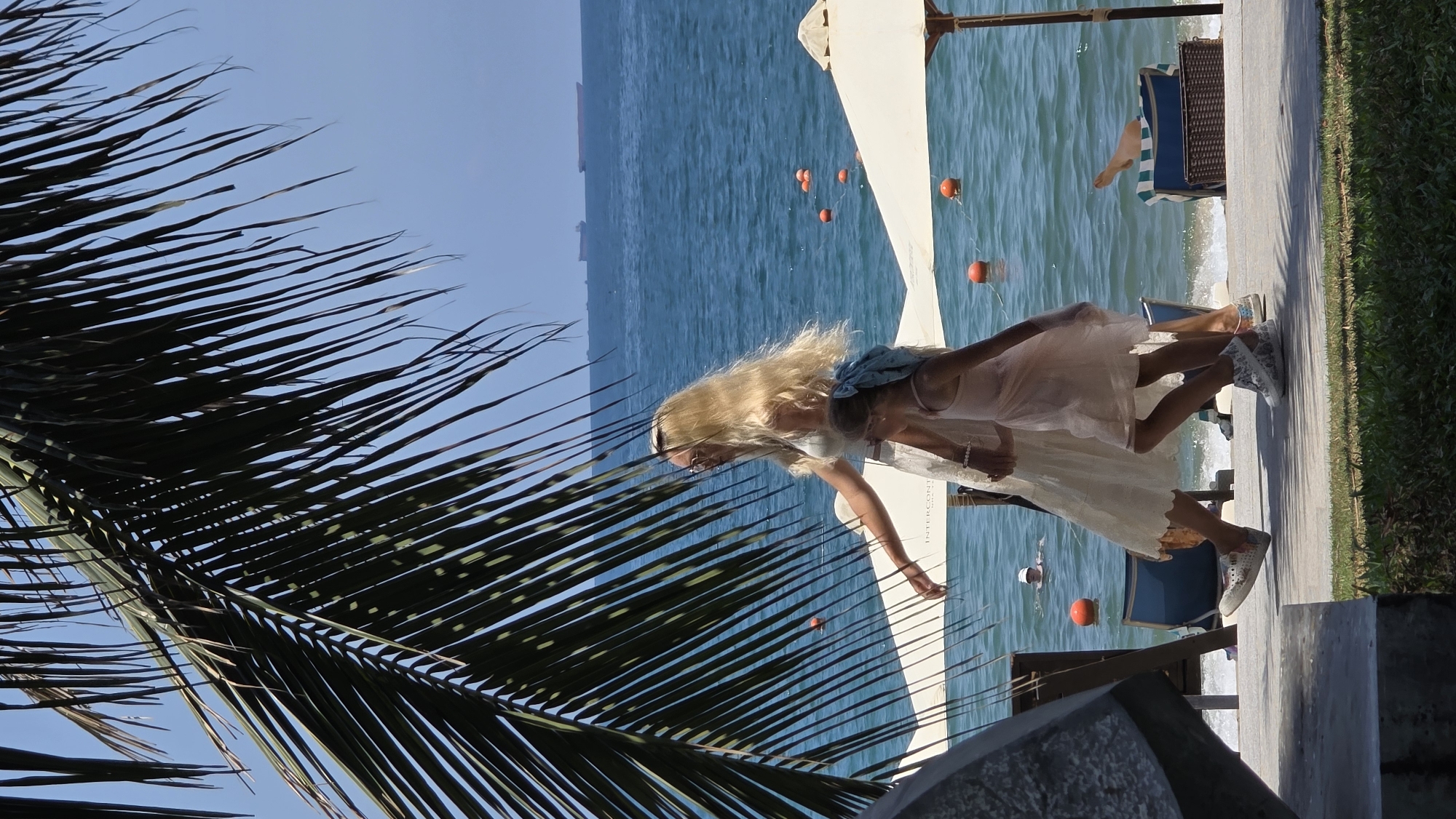 Woman stands at beachside location in Nha Trang, Vietnam