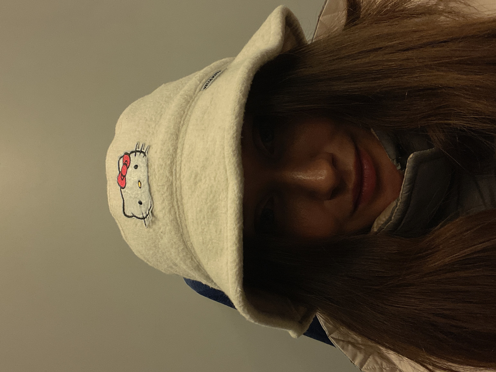Person poses in Hello Kitty hat in Sochi