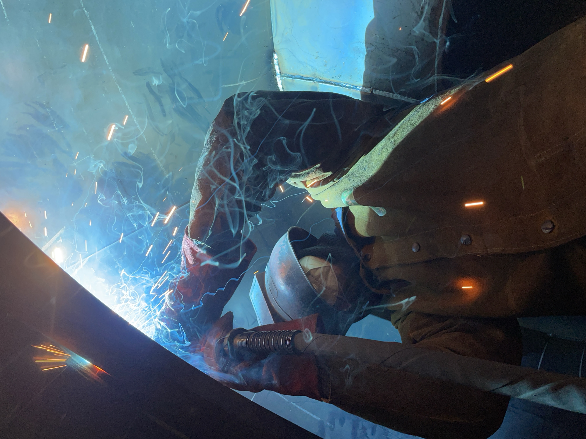 Welder works on metal beam in Zaljevo Montenegro