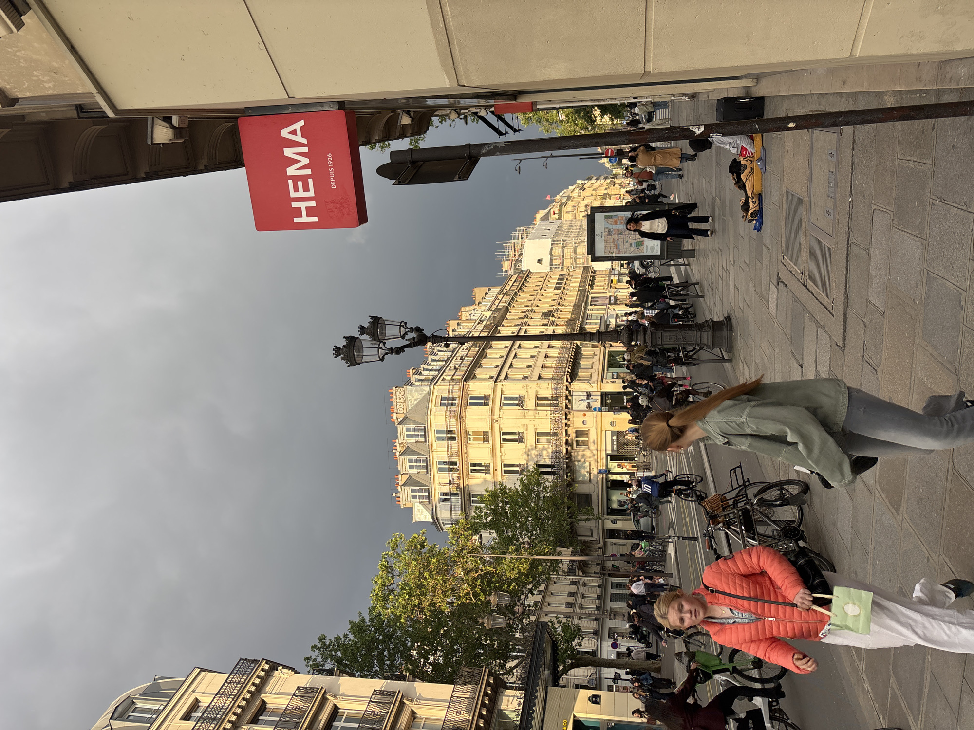 Evening street activity captured near Saint-Jacques Tower, Paris