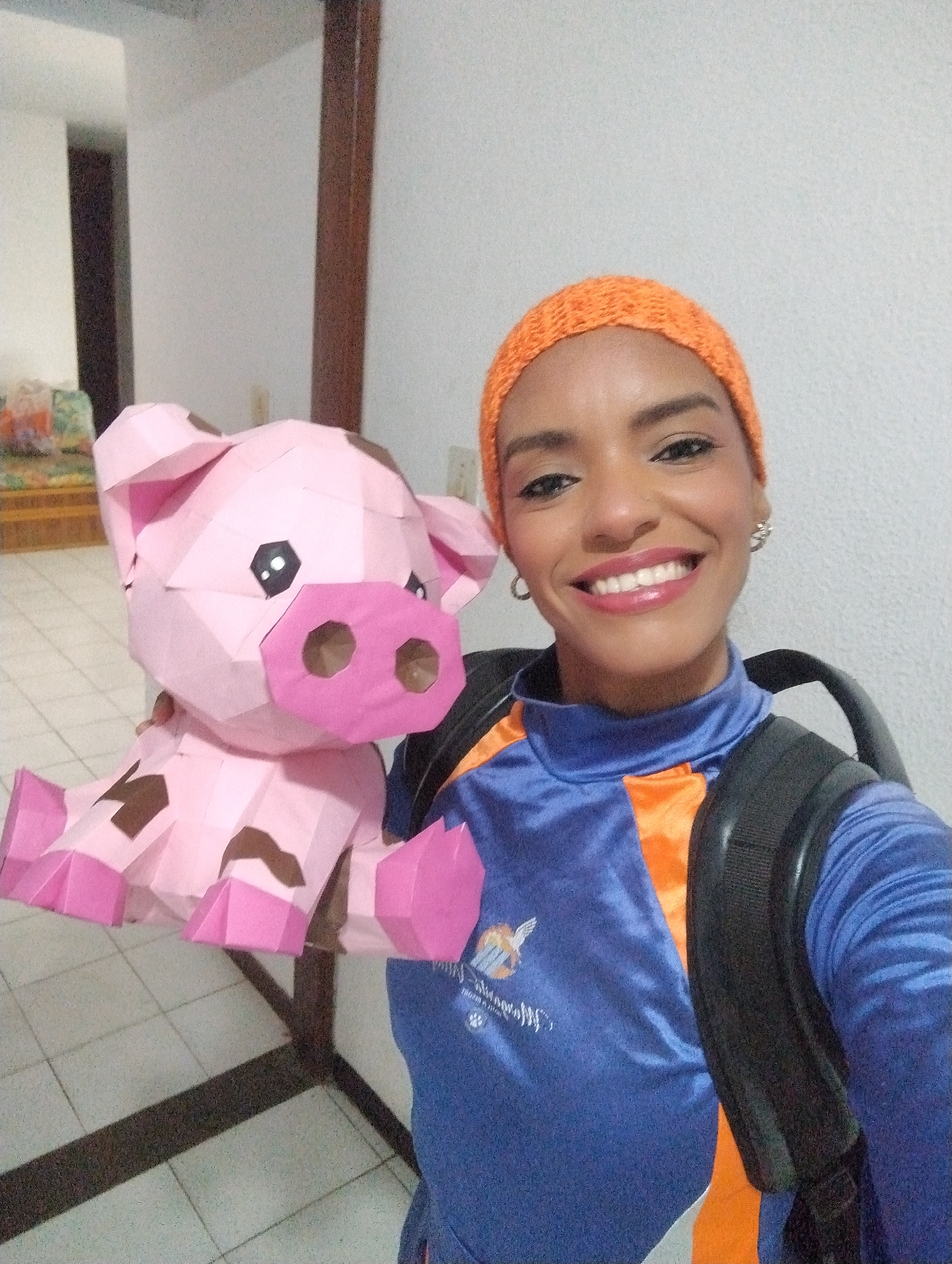 Tourist documents daily life, paper pig selfies in Porlamar
