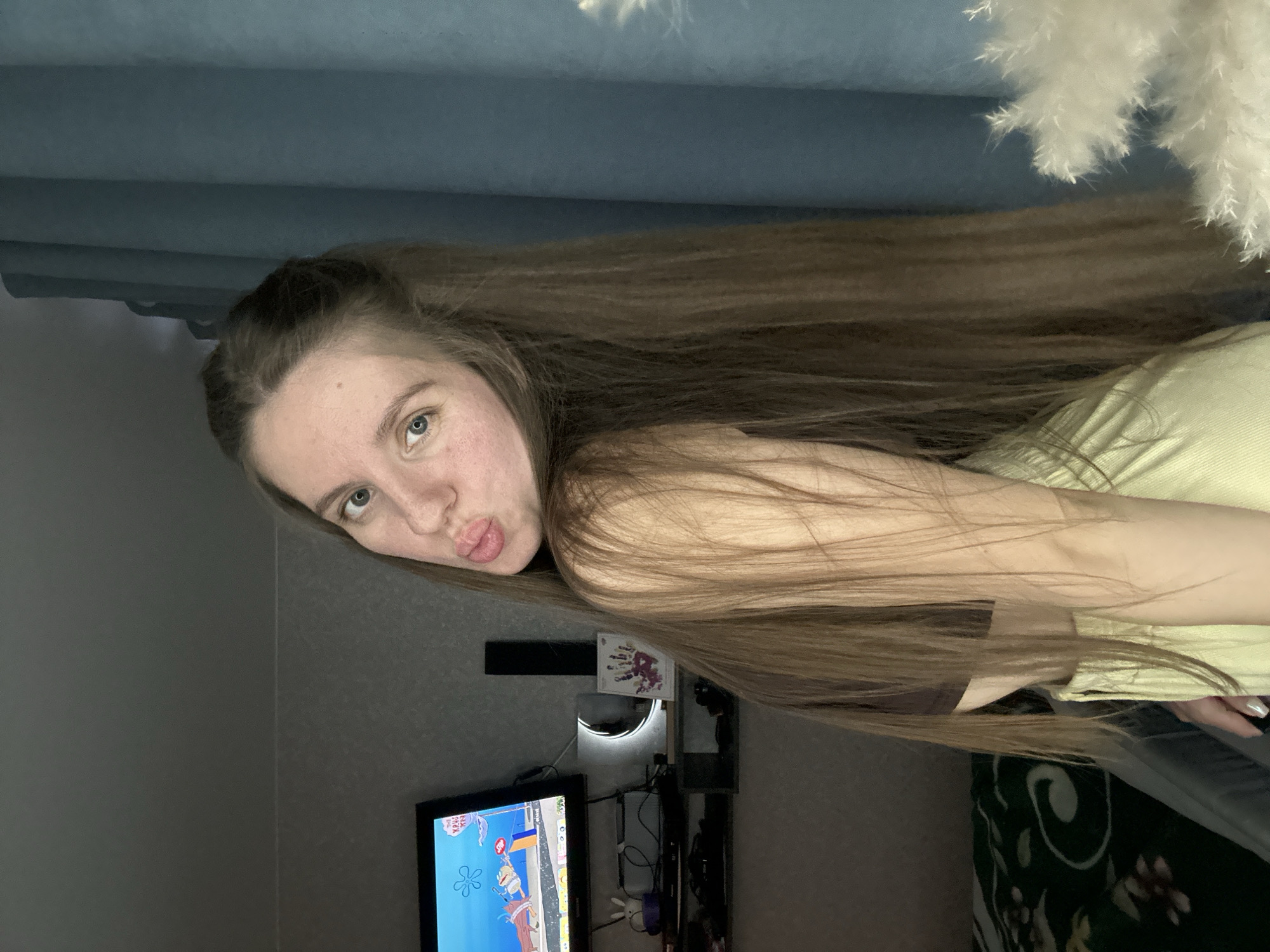 Woman takes multiple selfies in bedroom in Klin, Russia