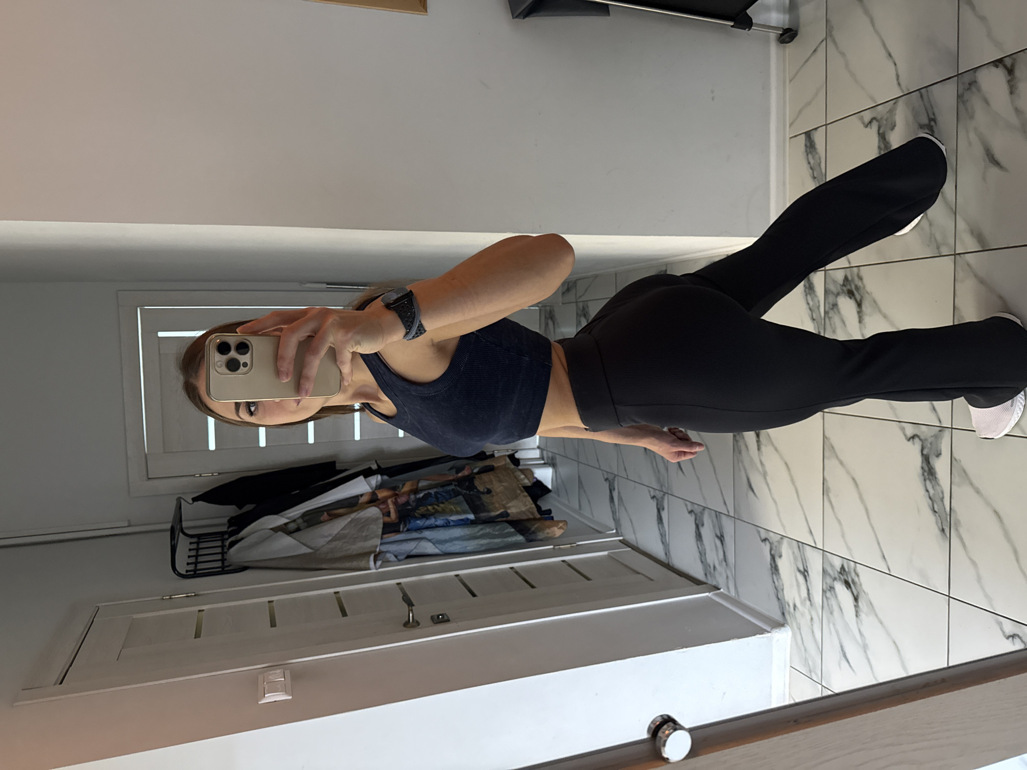 Woman Takes Mirror Selfies in Vyborg Bathroom