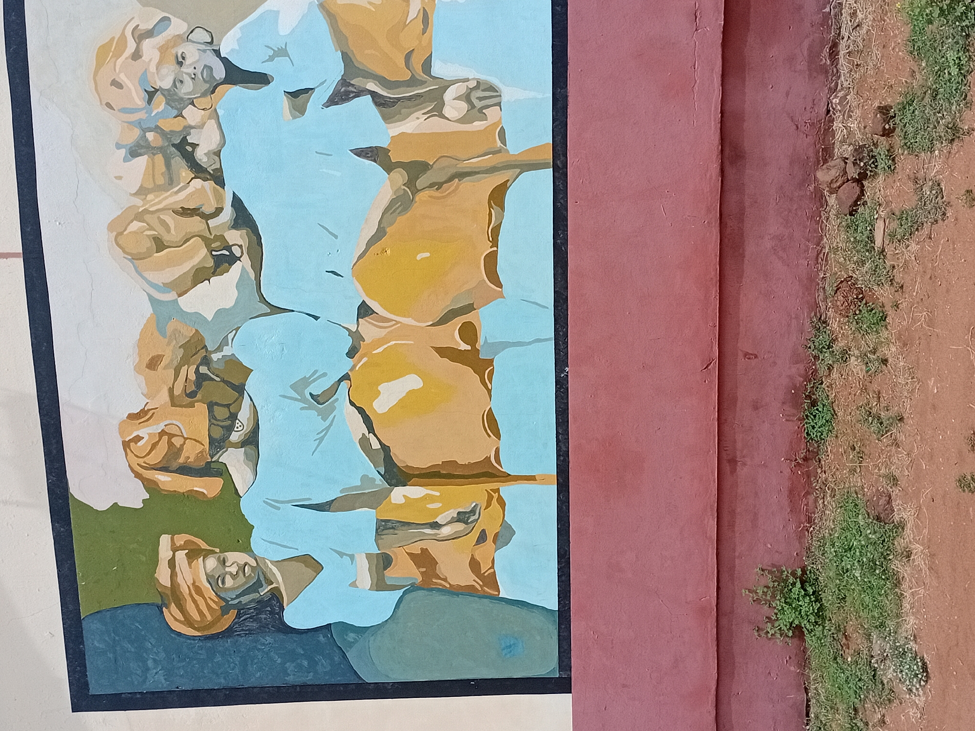 Wall painting with multiple figures spotted in Lokoja, Nigeria