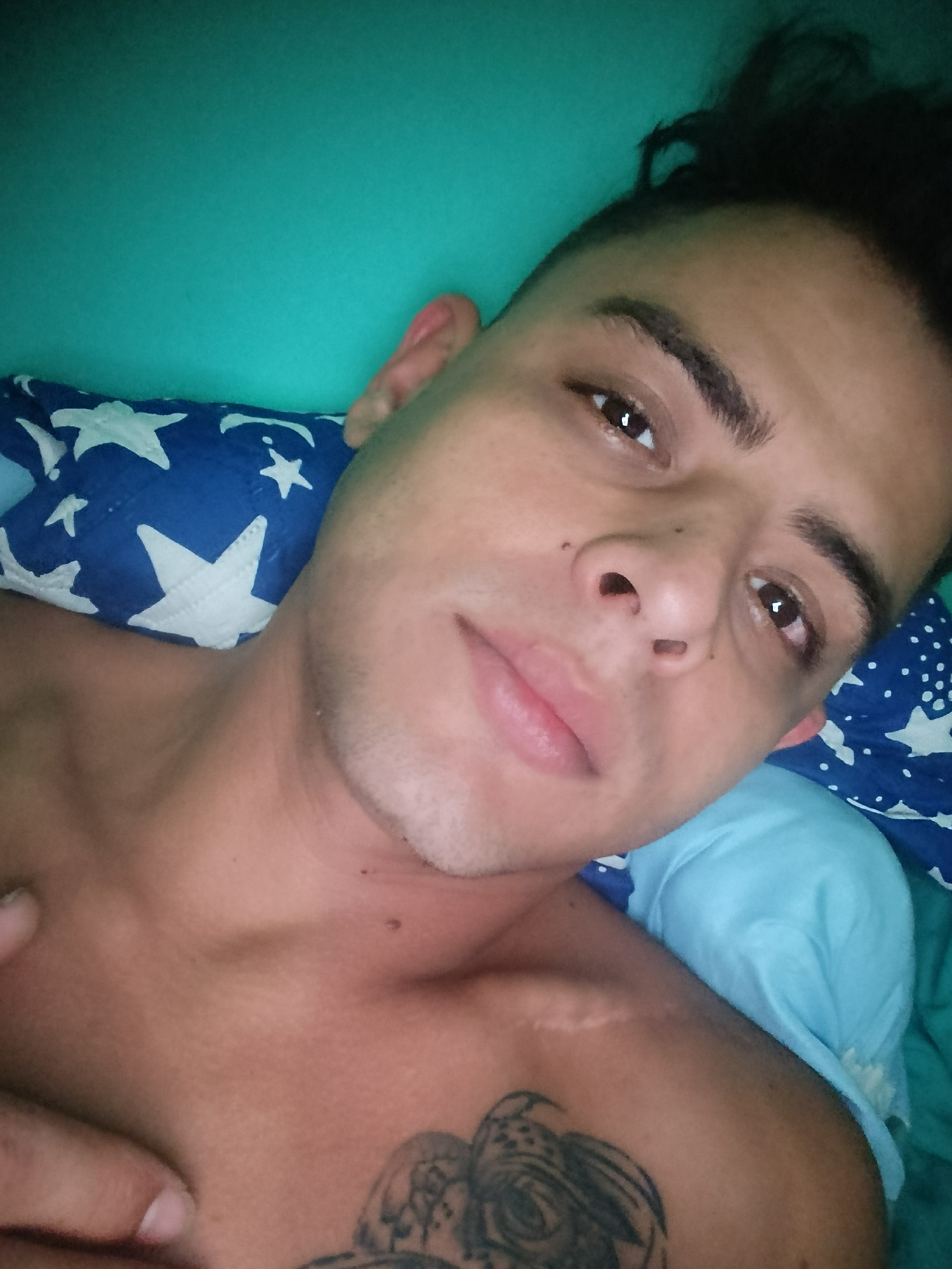 Man photographed in bed in Los Guayos, Venezuela