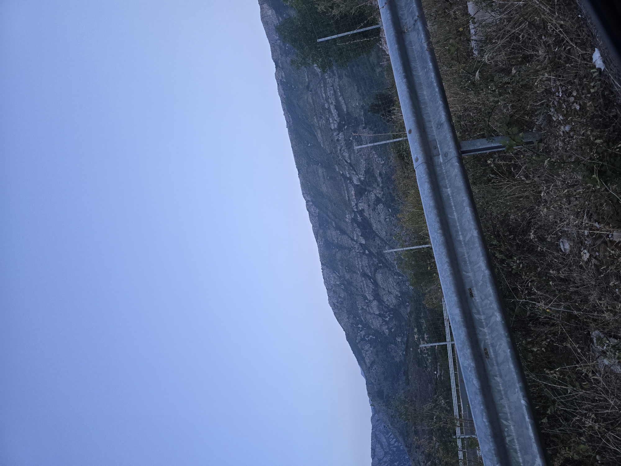 Mountain road drive through Klopot, Montenegro with graffiti underpasses