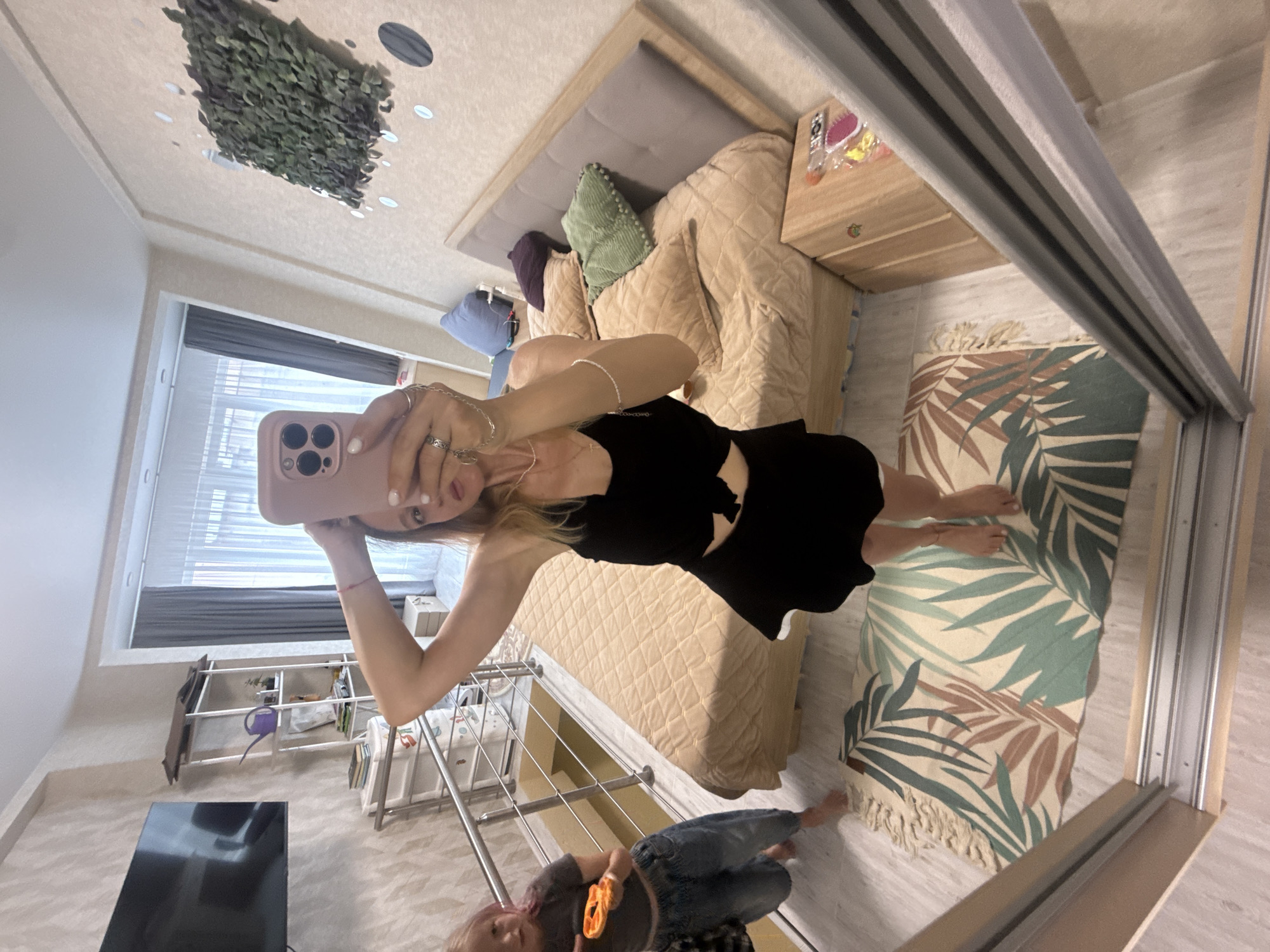 Woman Takes Extended Mirror Selfie Session in Bedroom