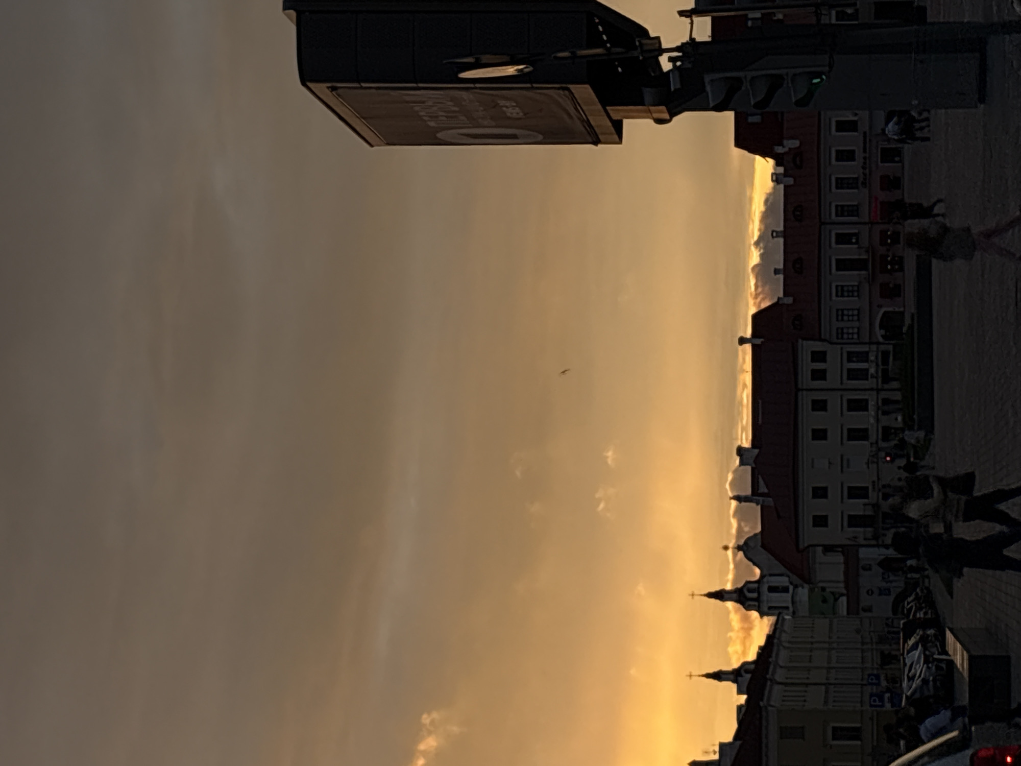 Dramatic sunset illuminates central Minsk during evening rush hour