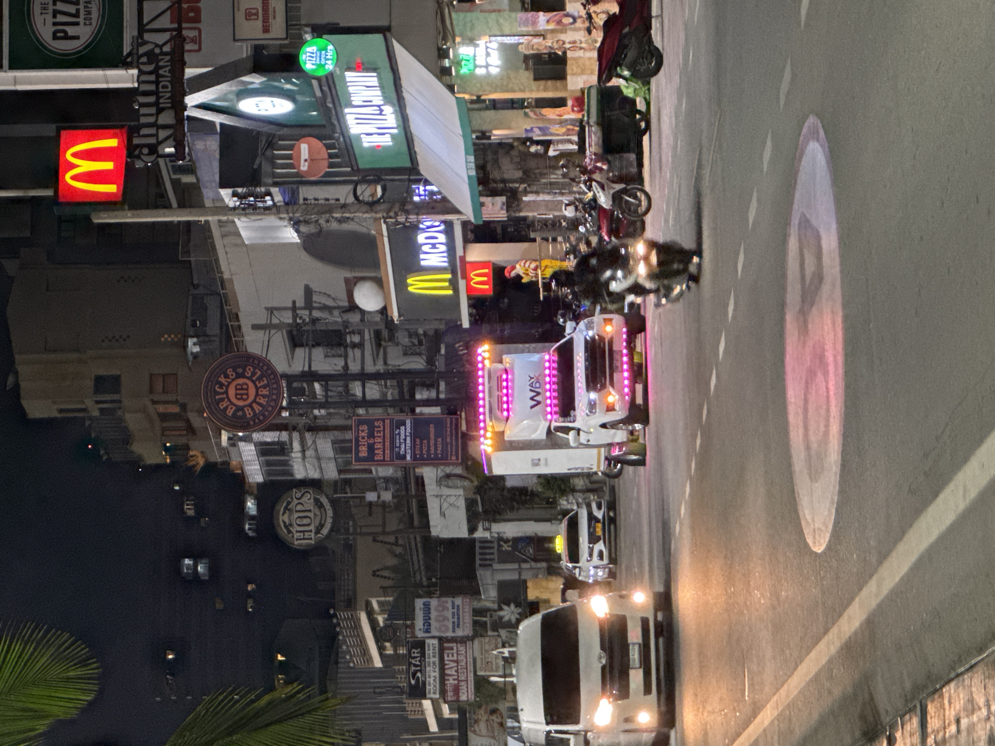 Nighttime street activity documented in Pattaya commercial district