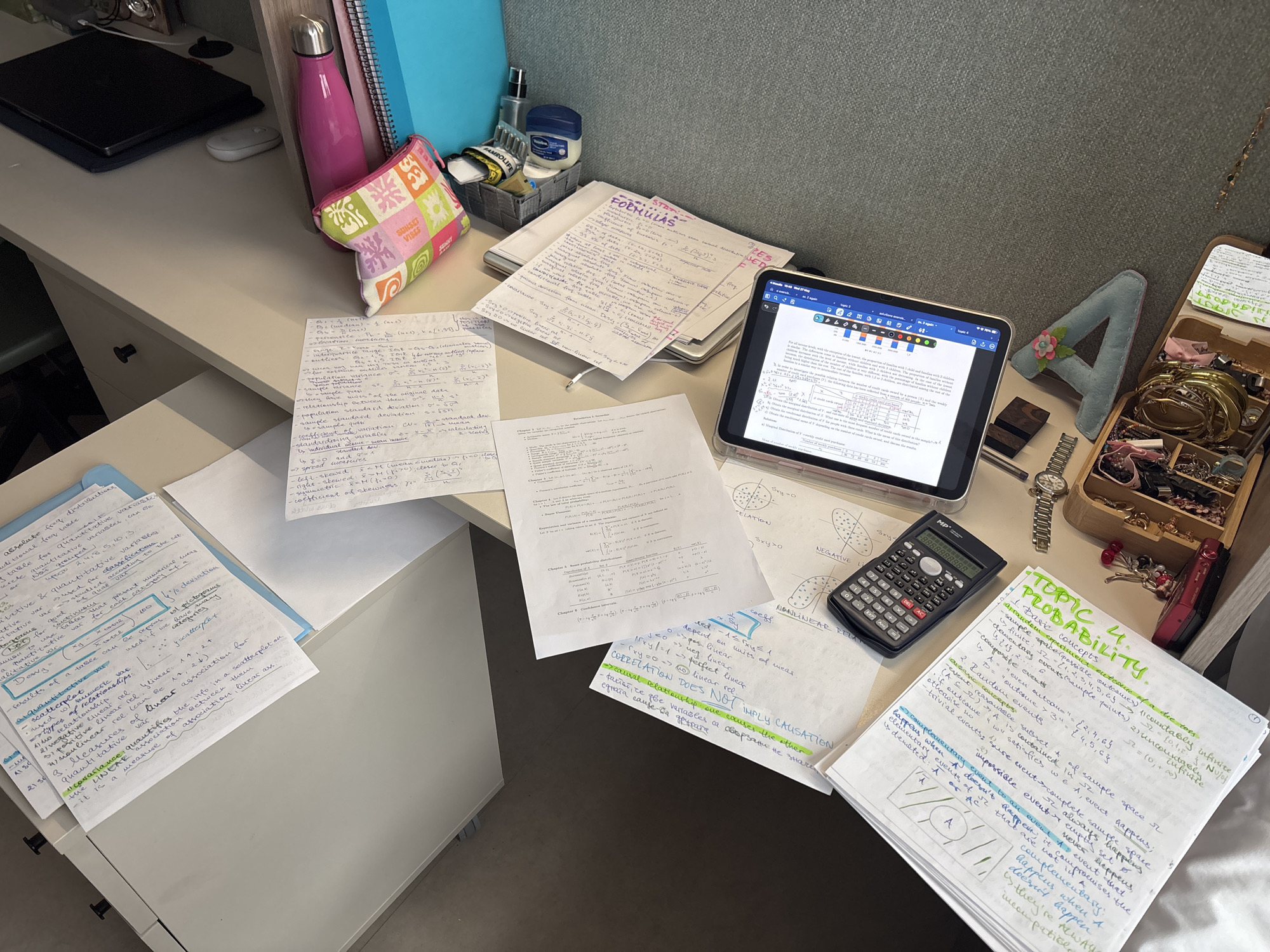 Student documents statistics study session in Getafe workspace