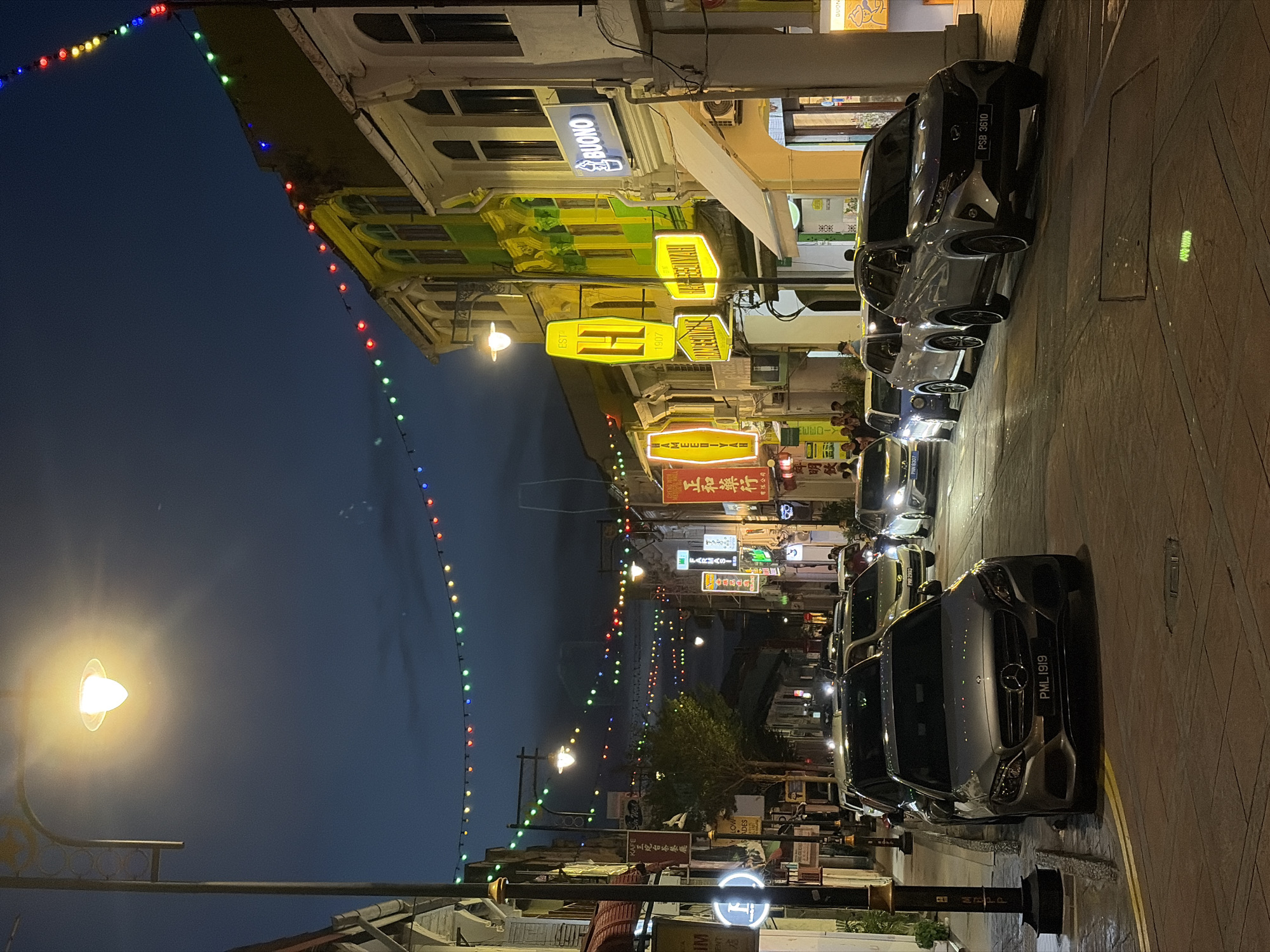 Night walk through a lively Southeast Asian city street