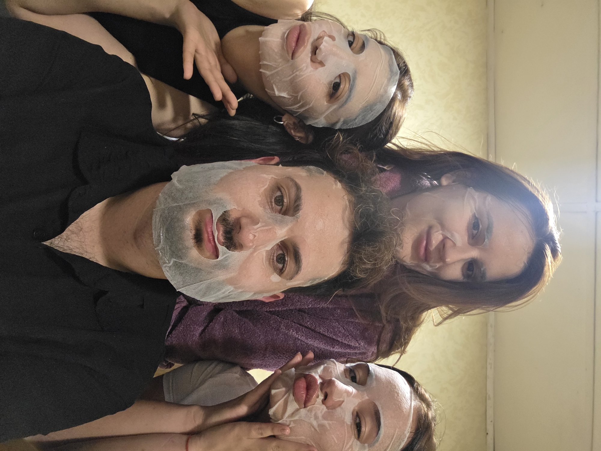 Four people pose for selfie in white attire, Bulgaria