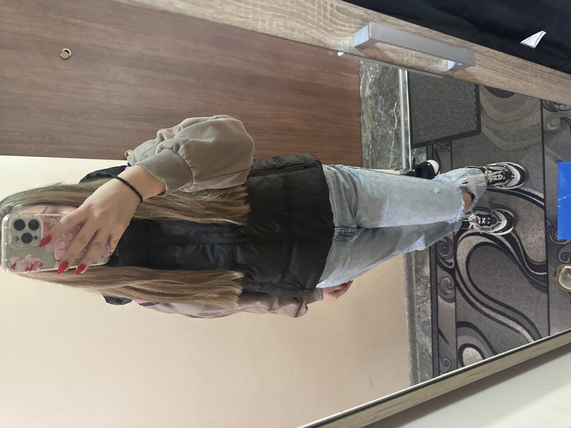 Woman takes early morning selfies in Montana, Bulgaria apartment