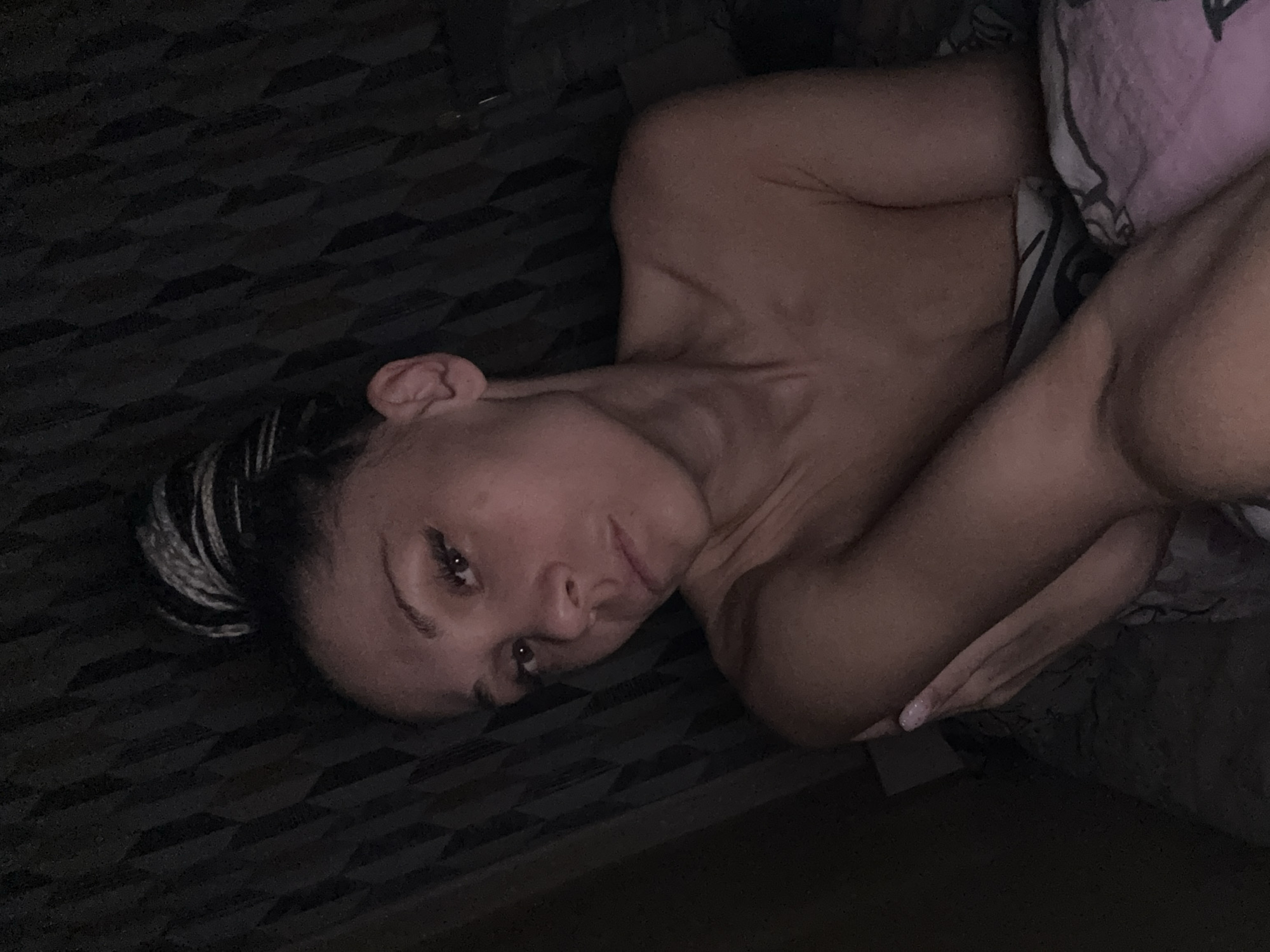Woman resting in dimly lit room in Rusanovo